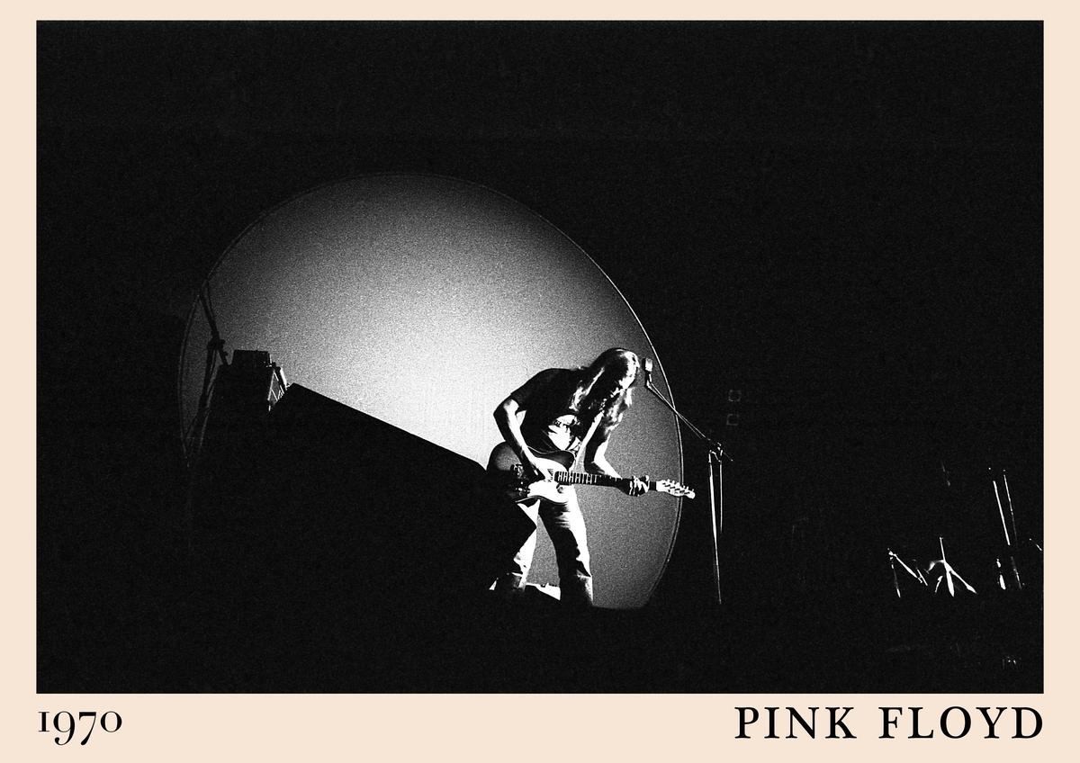 Poster featuring black and white 1970 Pink Floyd concert photo, guitarist on stage, large spotlight, retro rock wall art,