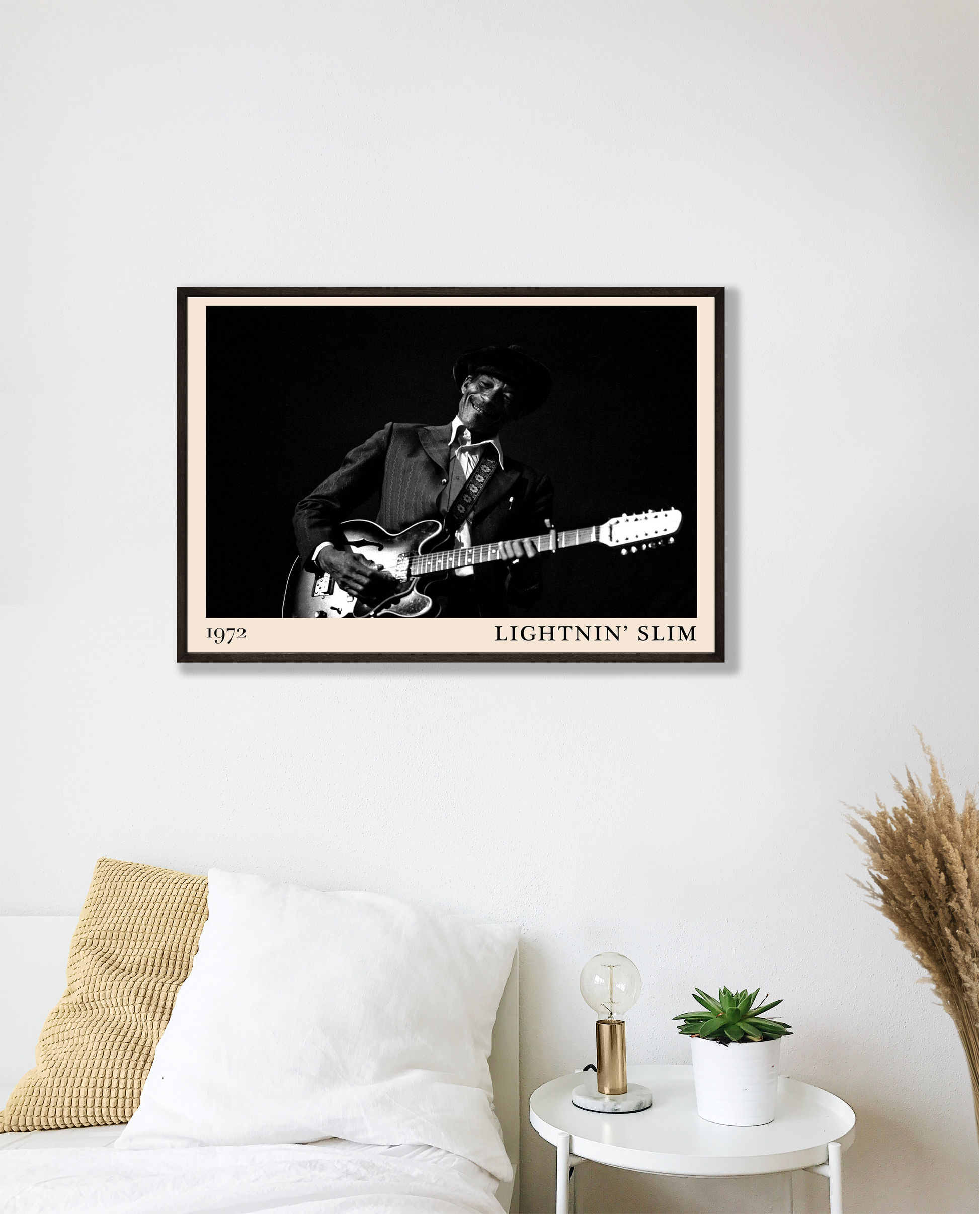 Lightnin Slim Blues Poster in a modern bedroom mockup, black and white musician portrait above white bedding and decor.