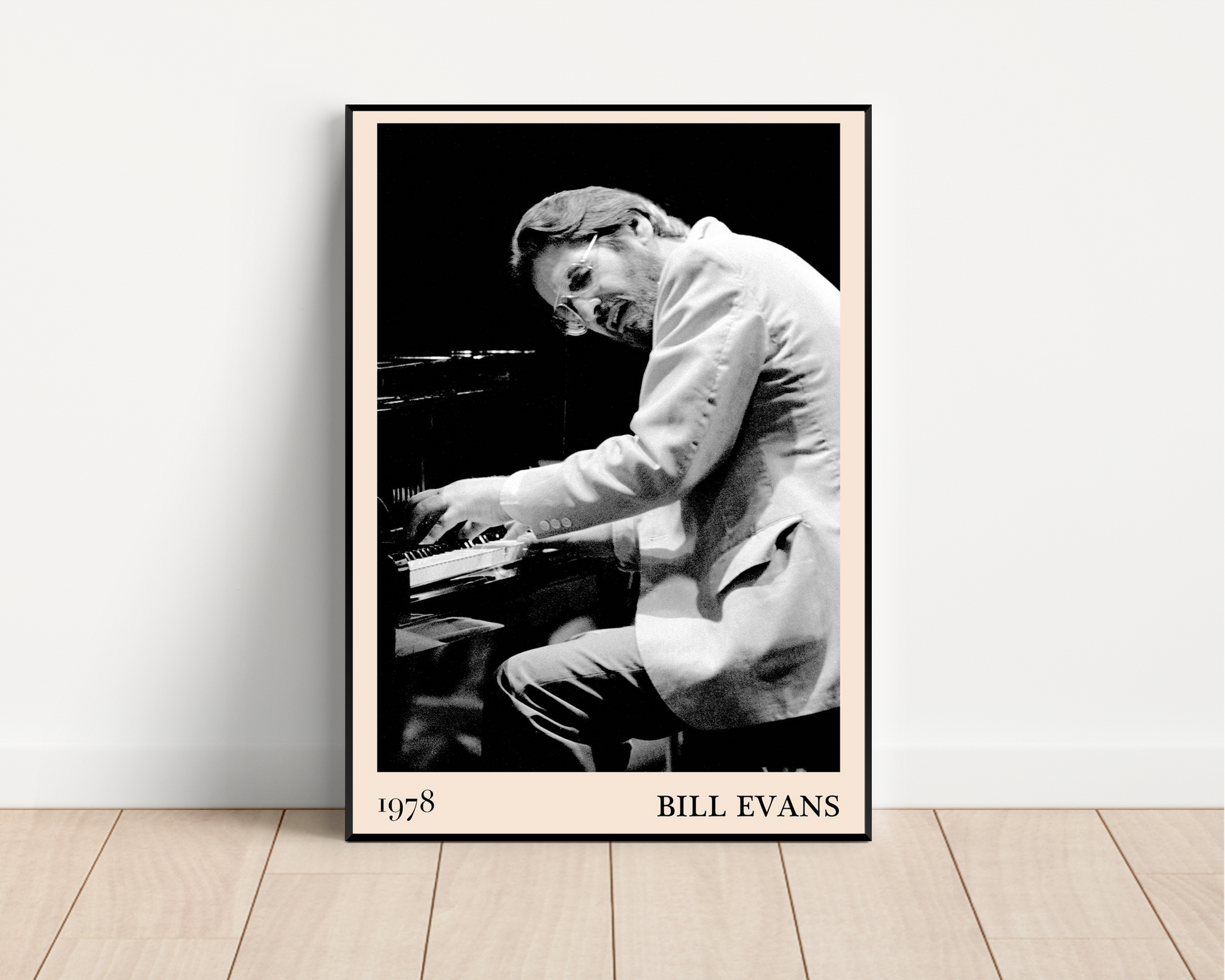 Bill Evans Jazz Concert Print in portrait mockup, black and white 1978 piano photo with cream border, leaning on wood floor