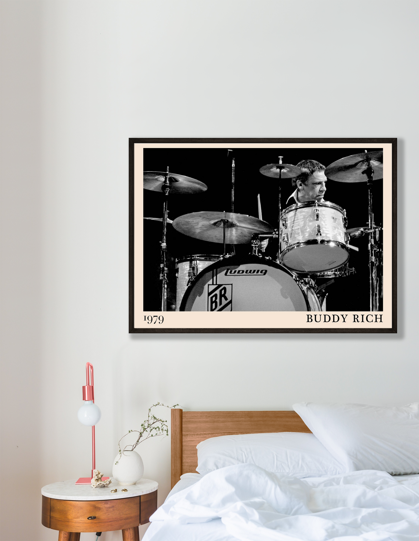 Buddy Rich Drummer Jazz Concert Print in landscape 16 mockup above modern wood bed, monochrome design and 1979 date visible.