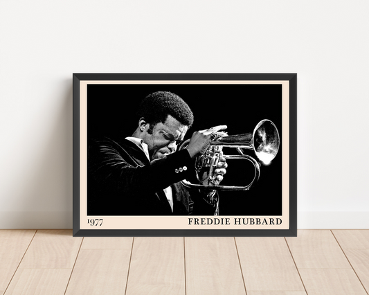 Freddie Hubbard Retro Jazz Print in landscape mockup, black and white portrait with trumpet, framed on wood floor.