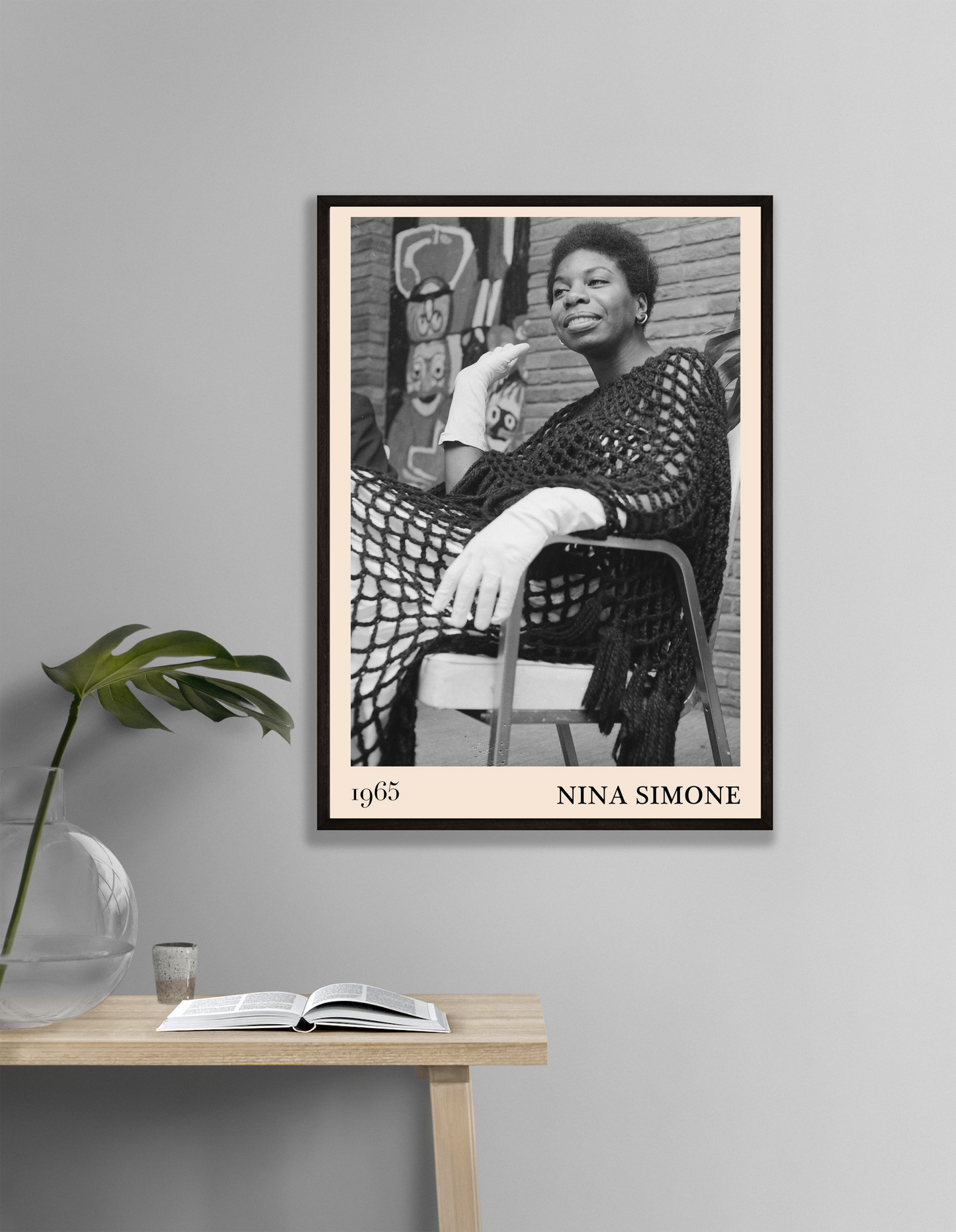 Nina Simone Jazz Print in modern portrait mockup, black and white wall art above wooden table with book and glass vase.