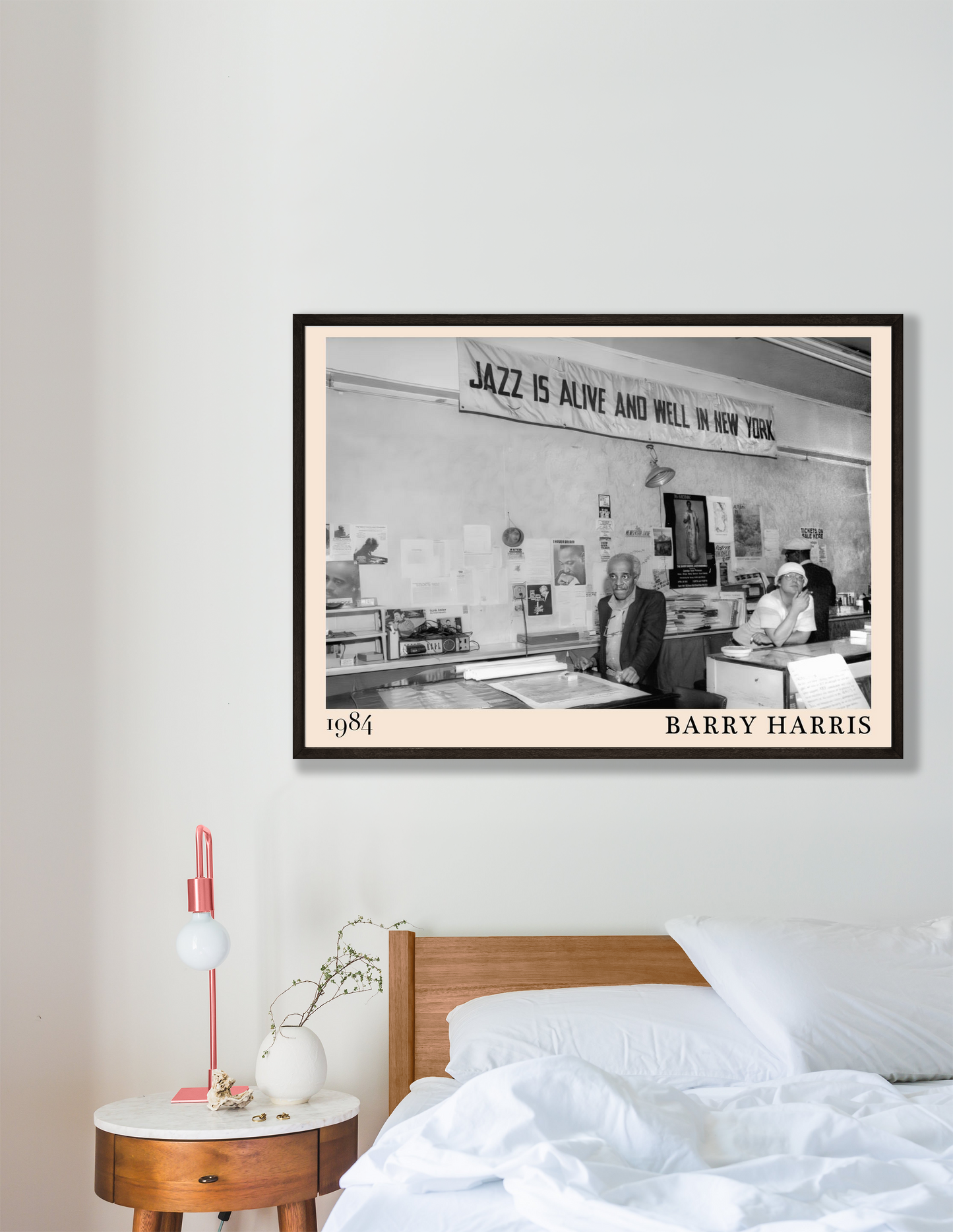 Barry Harris Retro Jazz Poster in a modern bedroom, featuring a black-and-white 1984 jazz scene above a wooden bed.