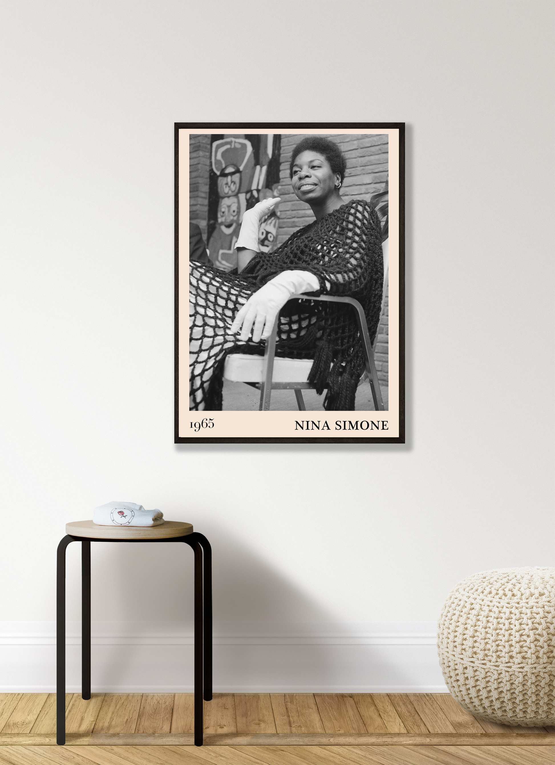 Nina Simone Jazz Print in modern living room mockup, black and white portrait poster framed above minimalist stool and pouf.