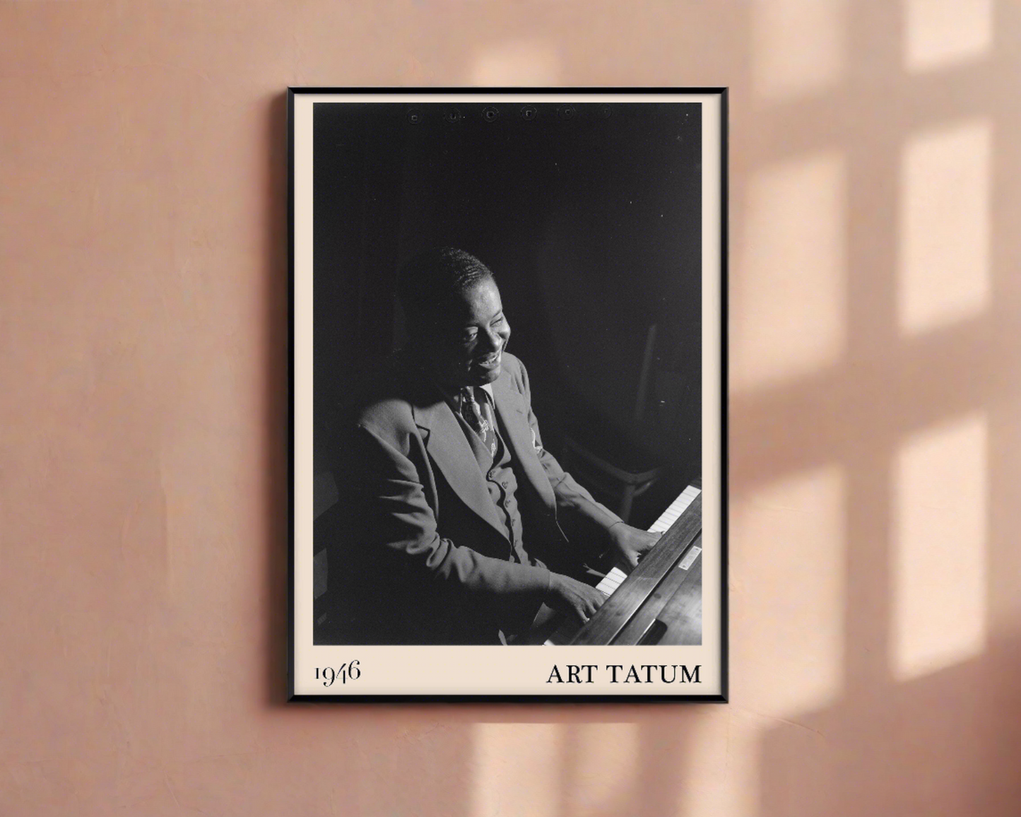 1946 photograph of Art Tatum crafted into a framed jazz poster. The poster has an off-white border and a thin black frame. The poster is hanging on a peach-coloured wall.