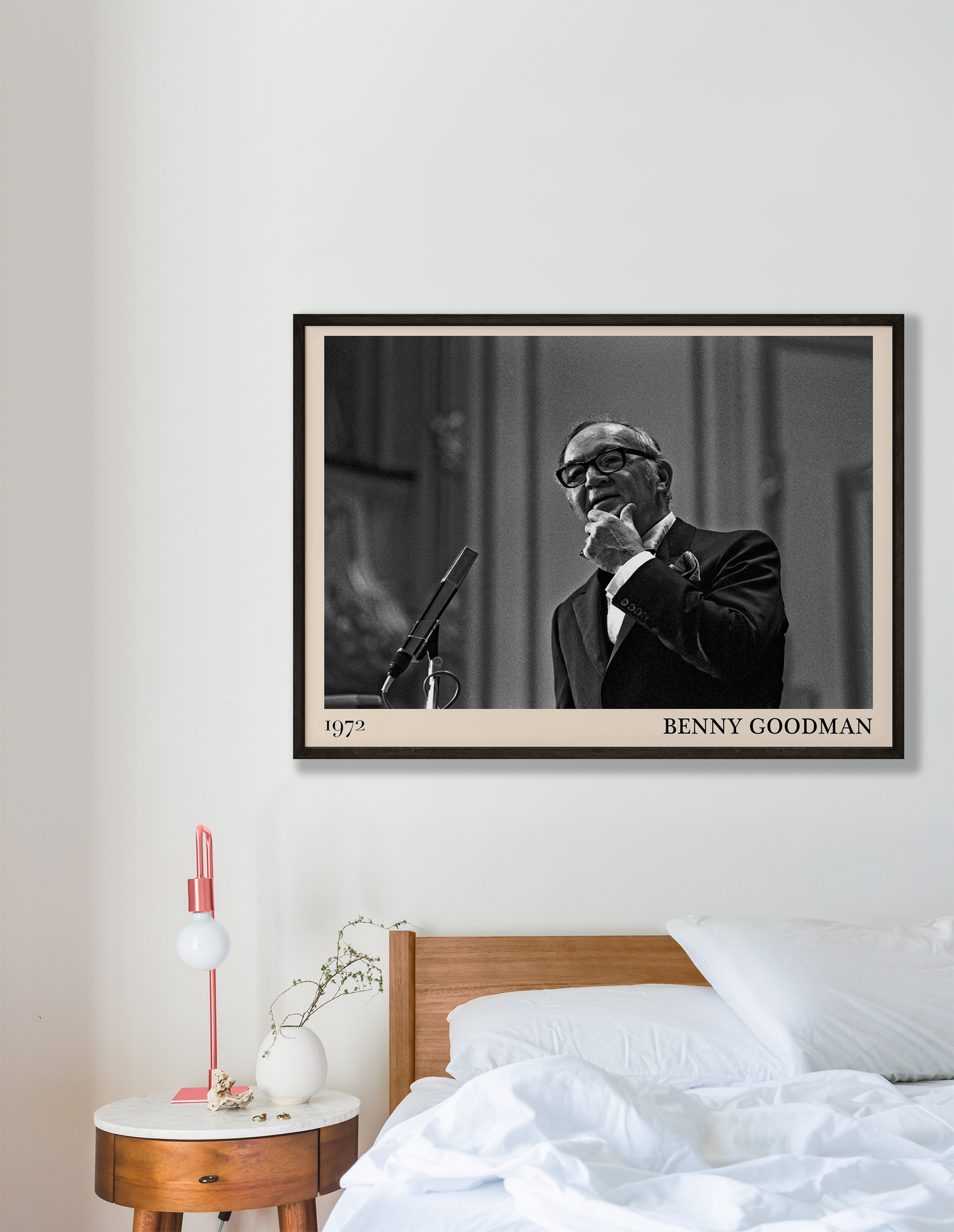 1972 photo of the Benny Goodman crafted into a black framed-poster, hanging on a white bedroom wall