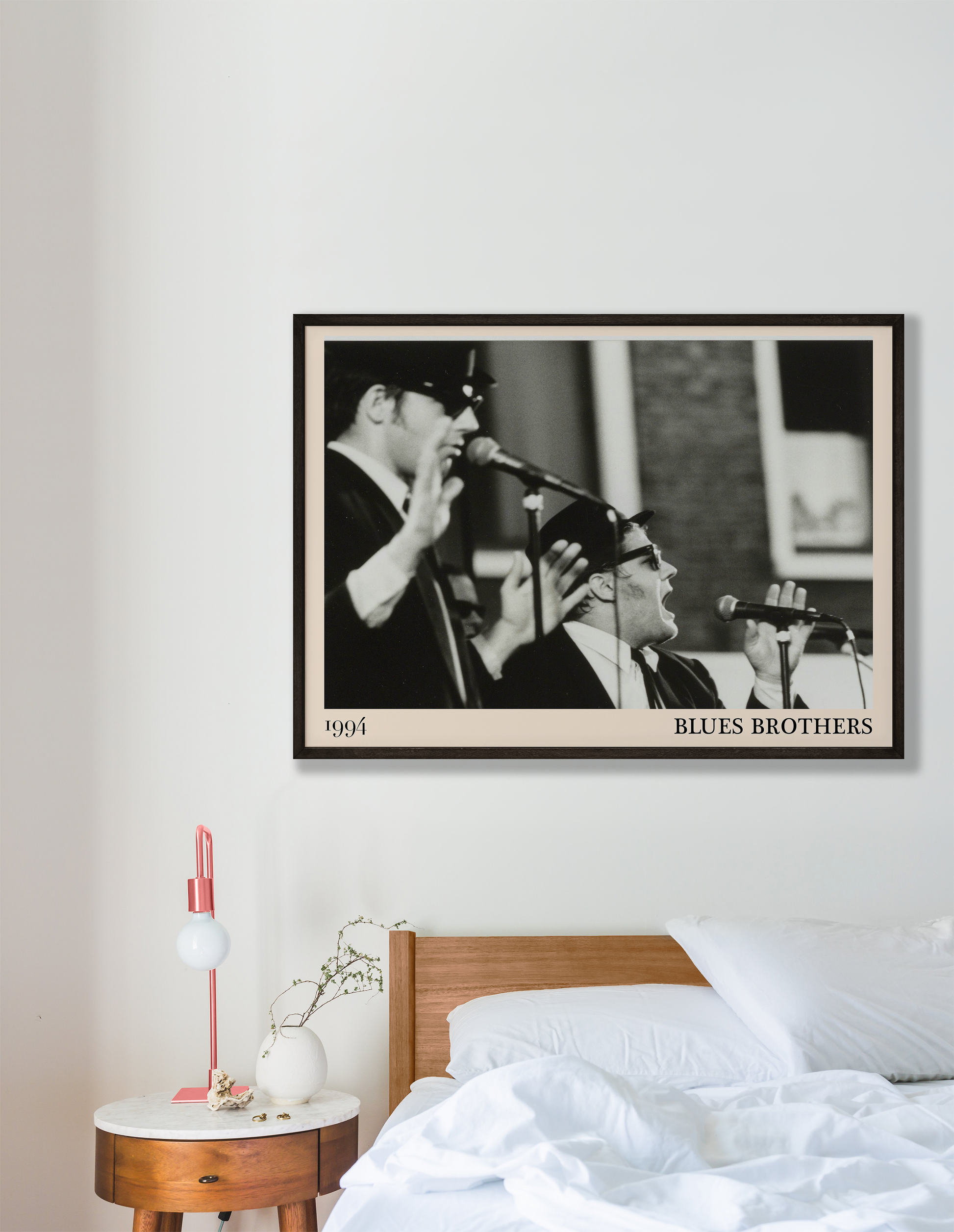 The Blues Brothers blues print hanging on a white bedroom wall