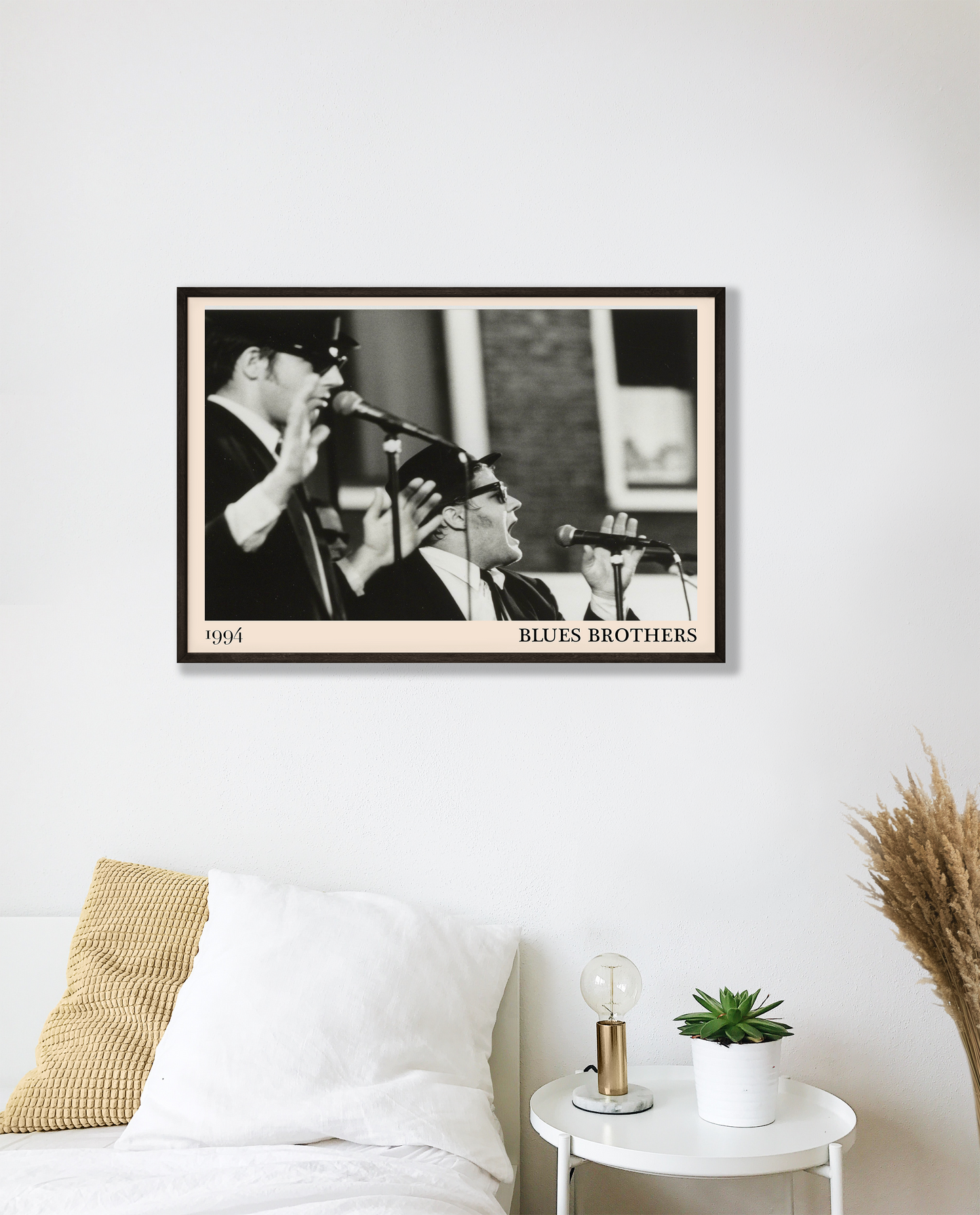 The Blues Brothers blues print hanging on a white bedroom wall