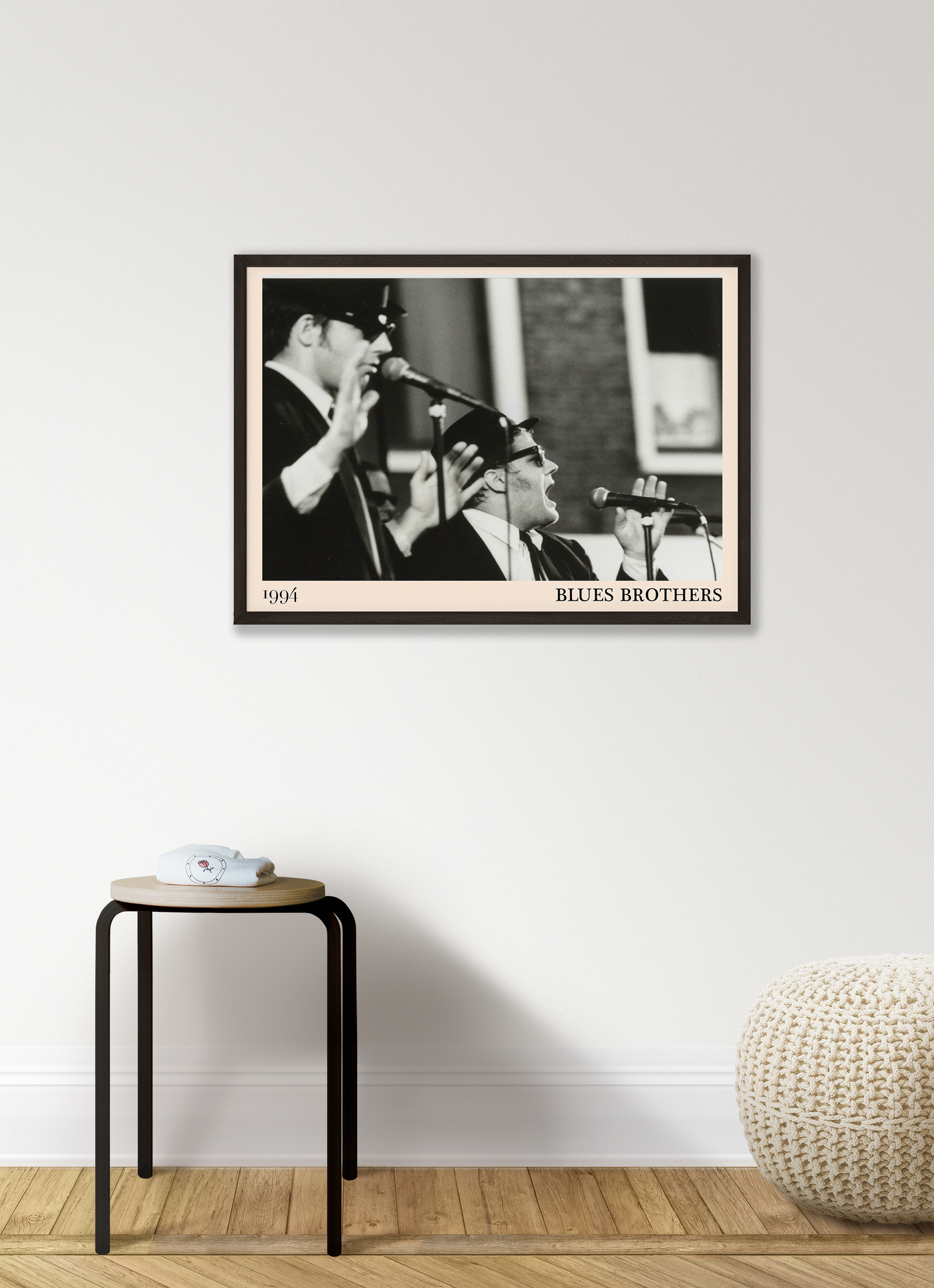 The Blues Brothers blues print hanging on a white bedroom wall