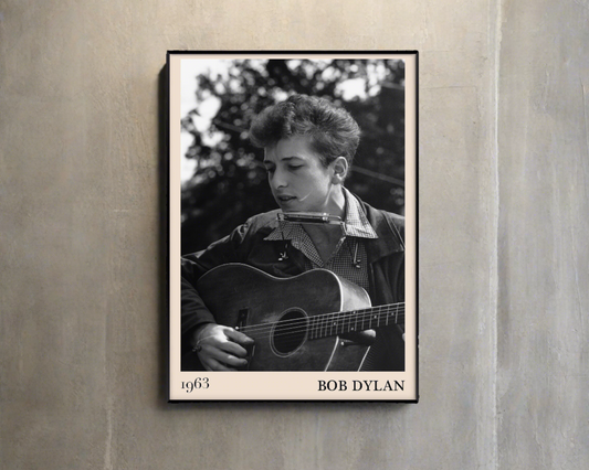 1963 photograph of Bob Dylan playing blues guitar crafted into cool framed blues poster, hanging on a grey/brown wall
