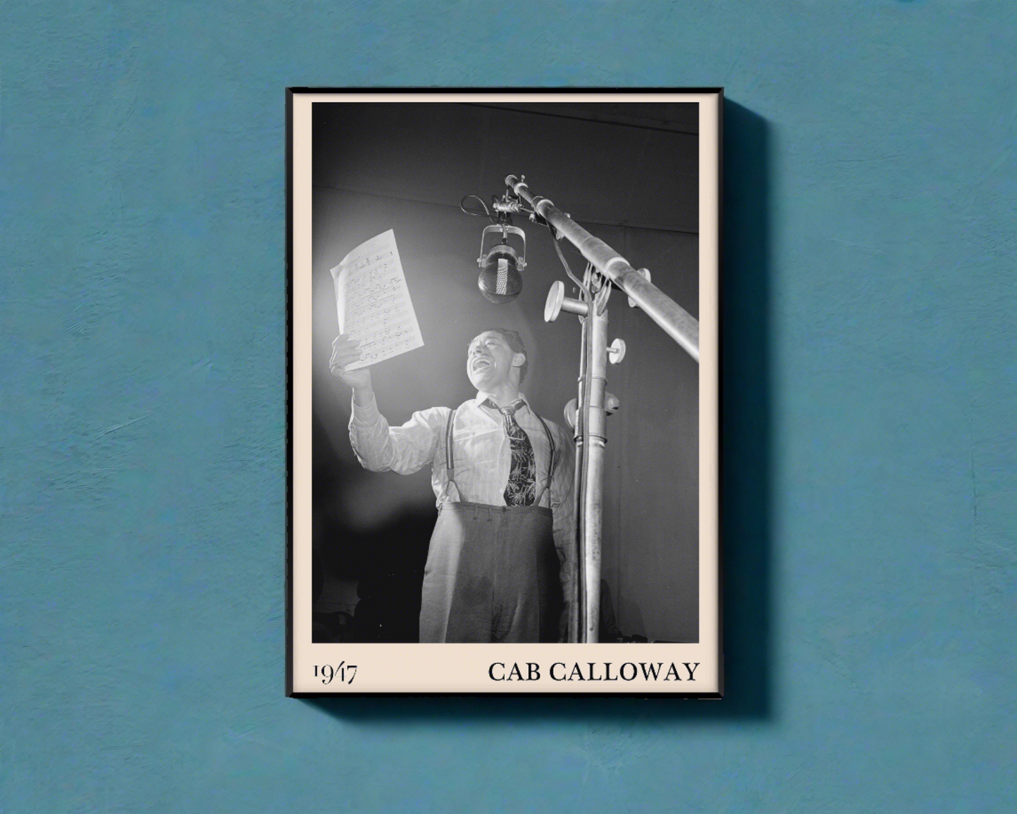 Vintage 1947 photo of Cab Calloway crafted into black framed poster, hanging on a bright blue wall