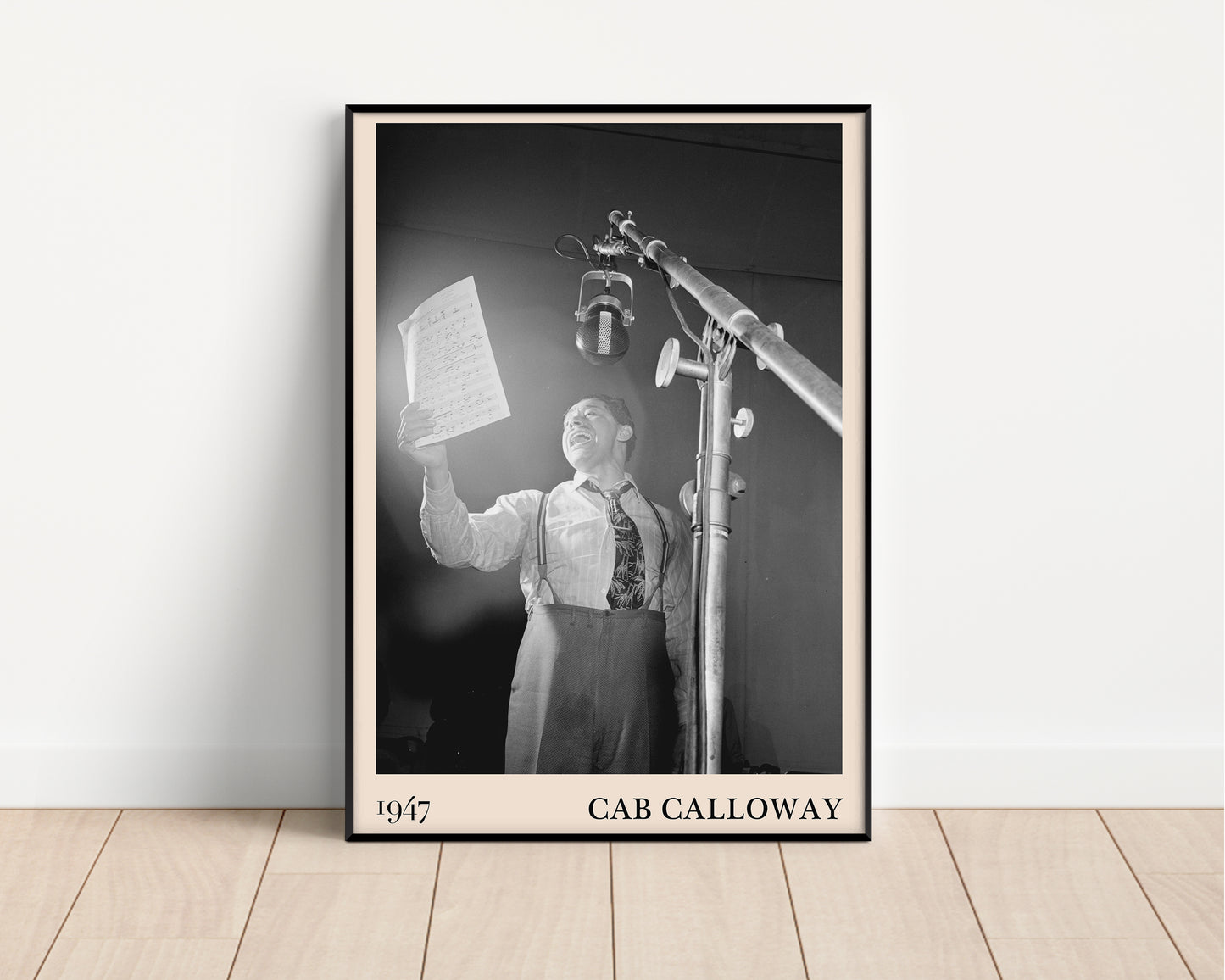 Vintage 1947 photo of Cab Calloway crafted into black framed poster, resting on a white wall