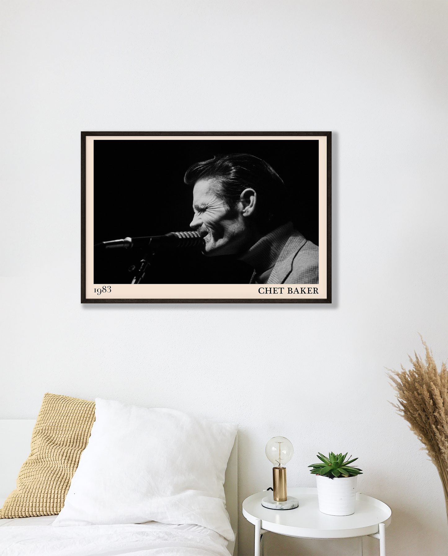 1983 photograph of Chet Baker singing, transformed into a stylish black-framed jazz poster hanging on a white bedroom wall