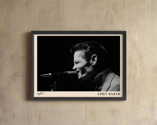 1983 photograph of Chet Baker singing, transformed into a stylish black-framed jazz poster hanging on a brown wall