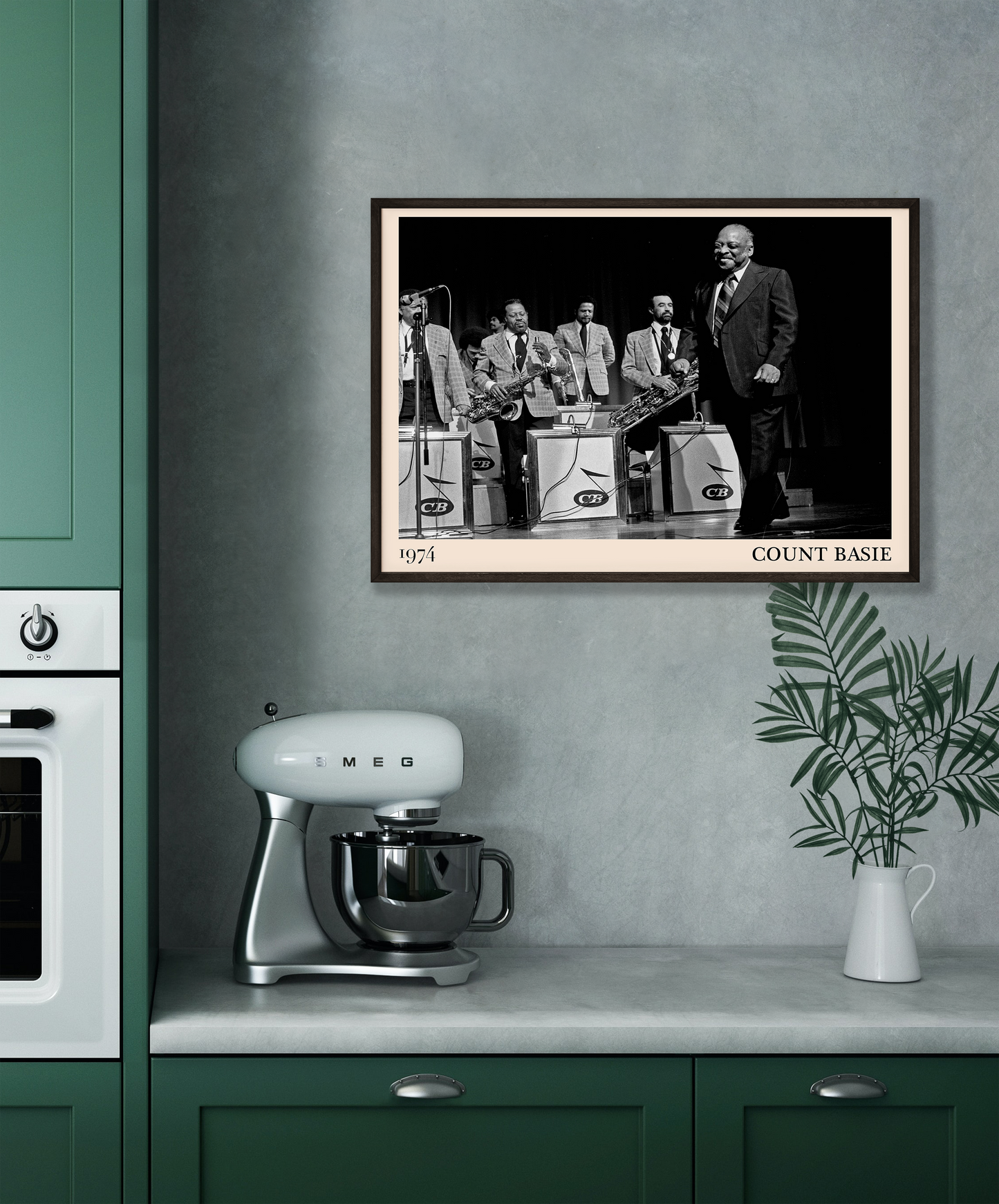 1974 photo of Count Basie crafted into a black framed-poster, hanging on a grey kitchen wall