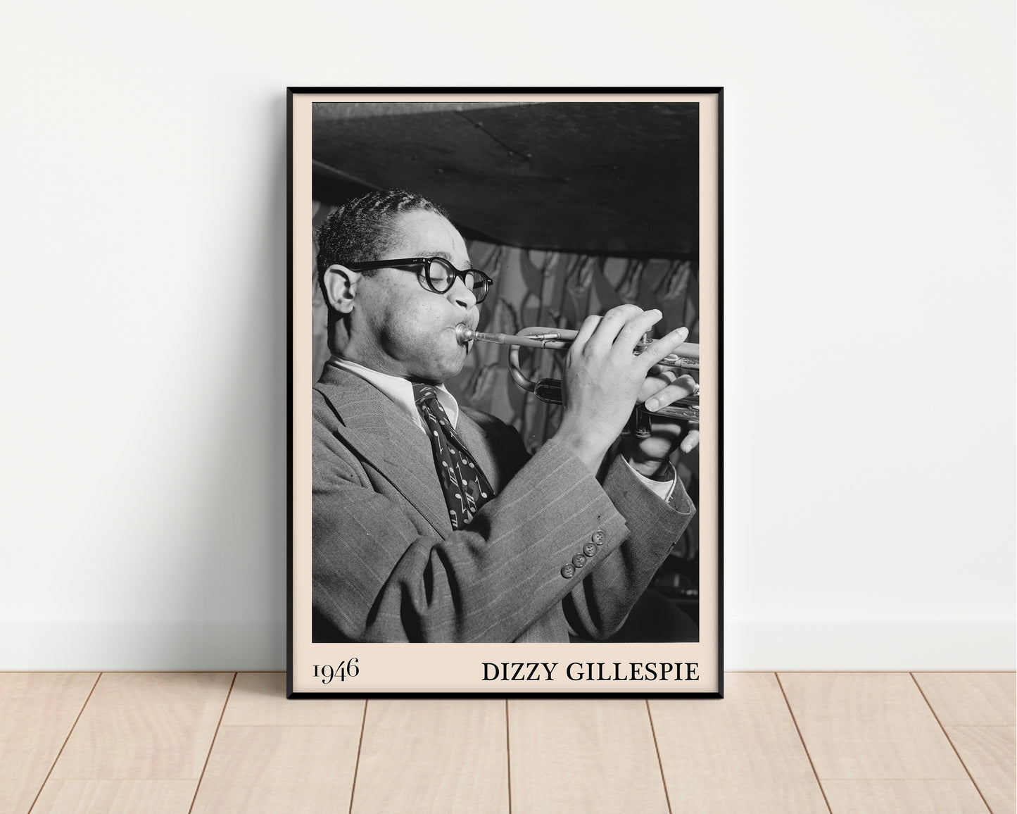 Vintage 1946 photo of Dizzy Gillespie crafted into black framed poster, resting on a white wall
