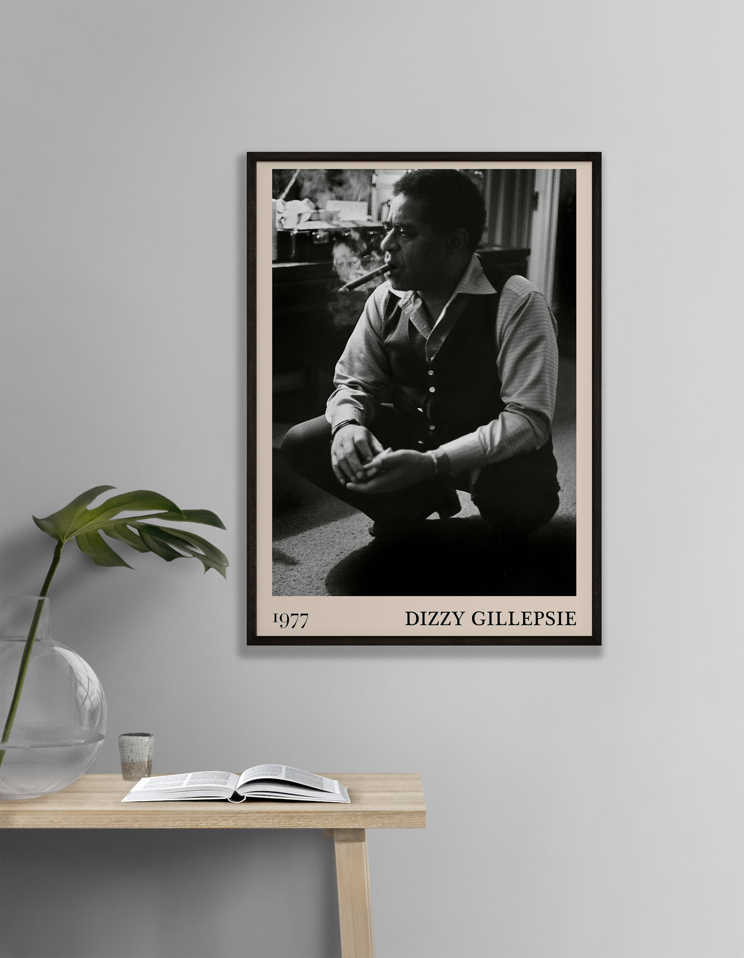 Vintage 1977 photo of Dizzy Gillespie crafted into black framed poster, hanging on a white living room wall