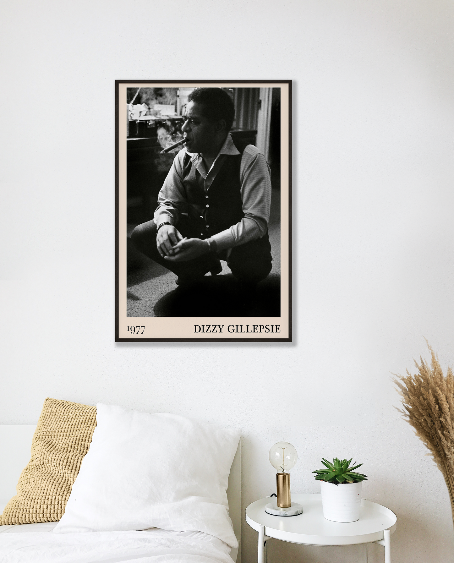 Vintage 1977 photo of Dizzy Gillespie crafted into black framed poster, hanging on a white bedroom wall