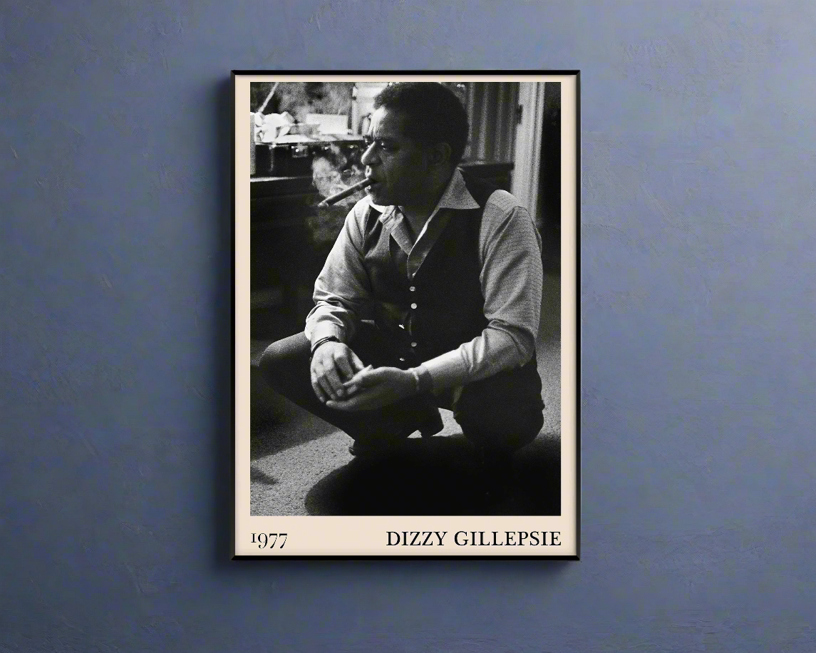 Vintage 1977 photo of Dizzy Gillespie crafted into black framed poster, hanging on a dark blue wall