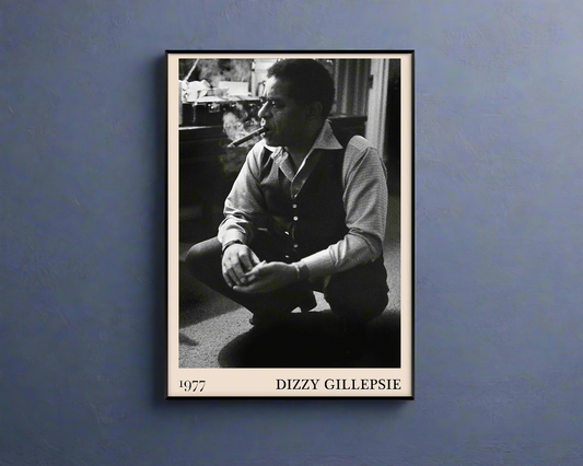 Vintage 1977 photo of Dizzy Gillespie crafted into black framed poster, hanging on a dark blue wall
