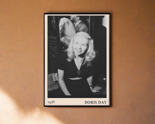 1946 photograph of  Doris Day. Transformed into a stylish black-framed jazz poster hanging on an orange wall