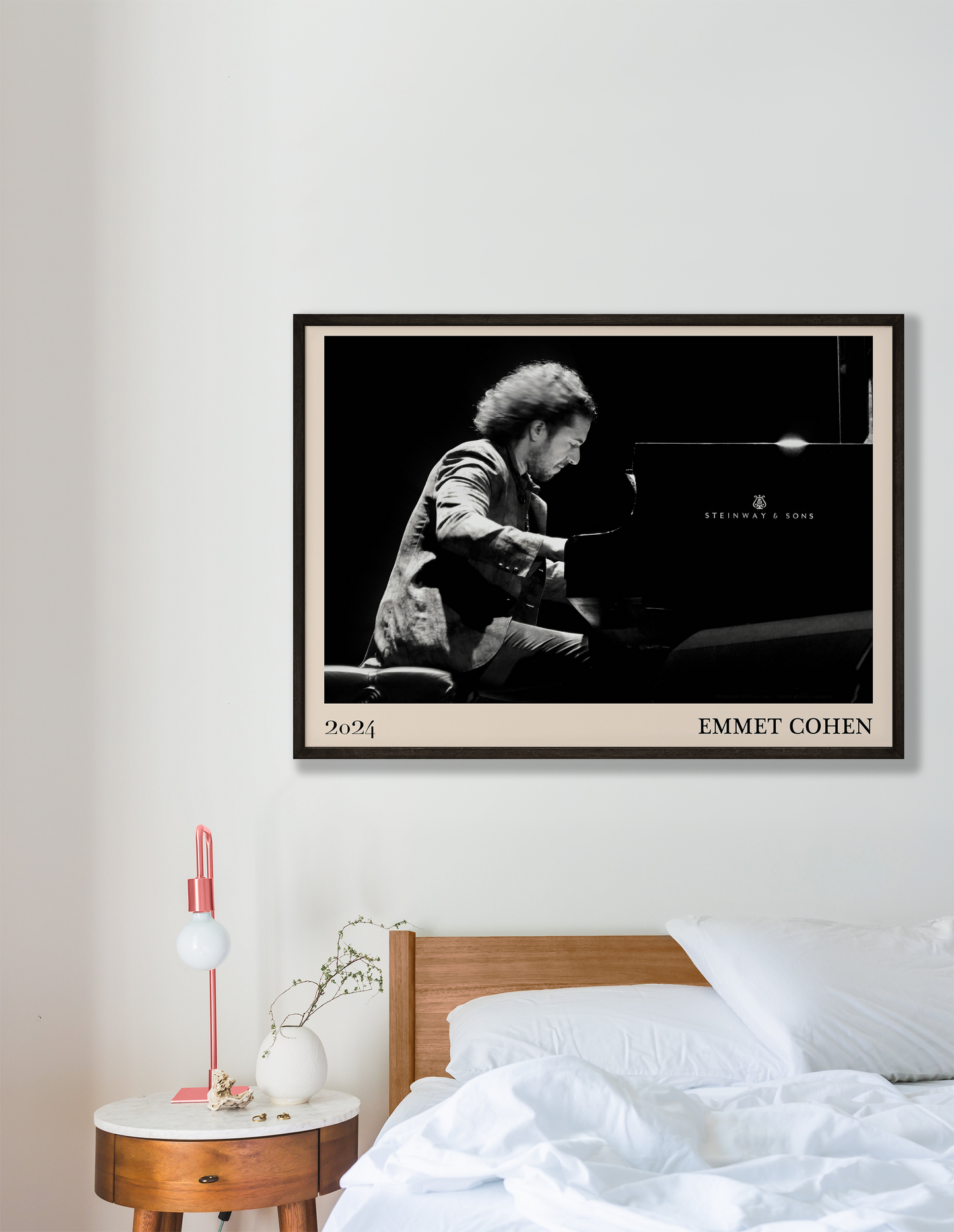 2024 photo of Emmet Cohen crafted into a black framed-poster, hanging on a white bedroom wall