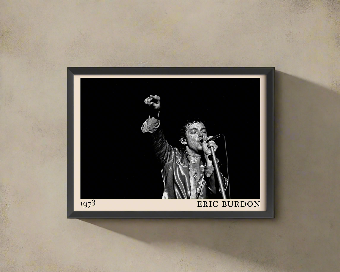 Iconic image of rock musician Eric Burdon performing, captured by Heinrich Klaffs and transformed into vintage-inspired wall decor hanging on a light rustic concrete wall in dappled sunlight