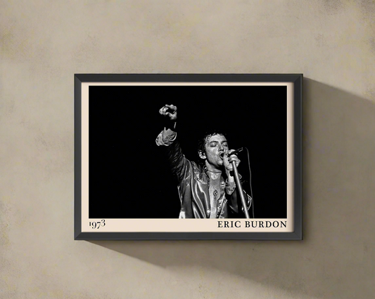 Iconic image of rock musician Eric Burdon performing, captured by Heinrich Klaffs and transformed into vintage-inspired wall decor hanging on a light rustic concrete wall in dappled sunlight