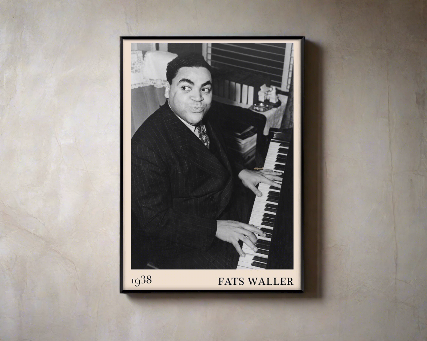 1938 photograph of Fats Waller crafted into a black framed jazz poster. The poster is hanging on a brown living room wall.