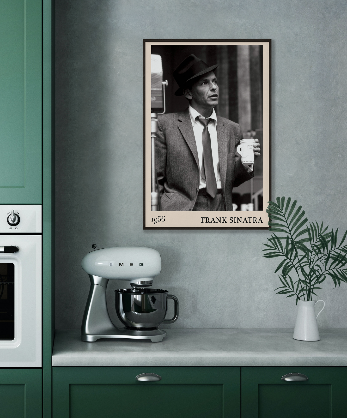1956 photo of Frank Sinatra crafted into a black framed-poster, hanging on a grey kitchen wall