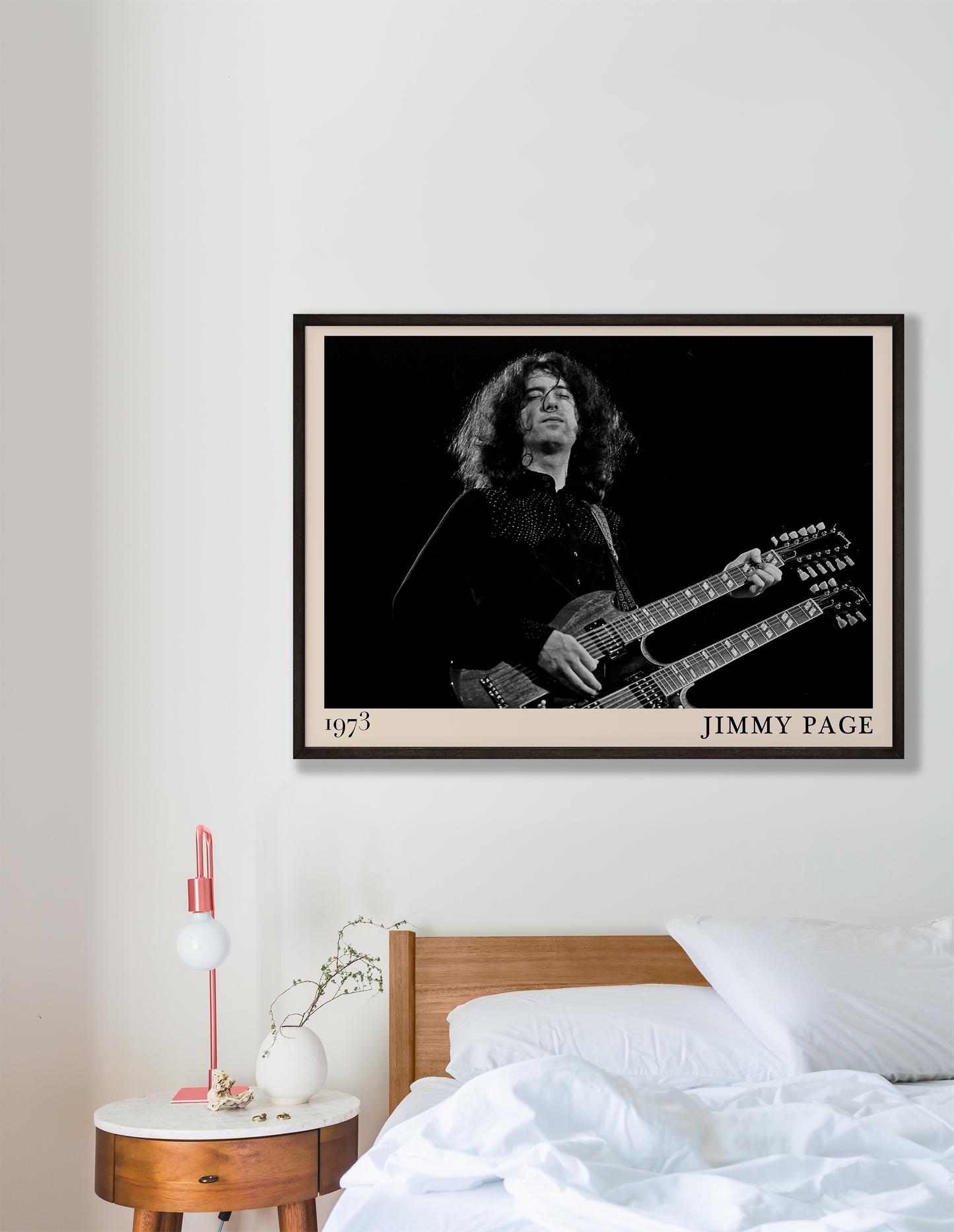 Iconic image of rock guitarist Jimmy Page performing, captured by Heinrich Klaffs and transformed into vintage-inspired wall decor hanging on a white bedroom wall