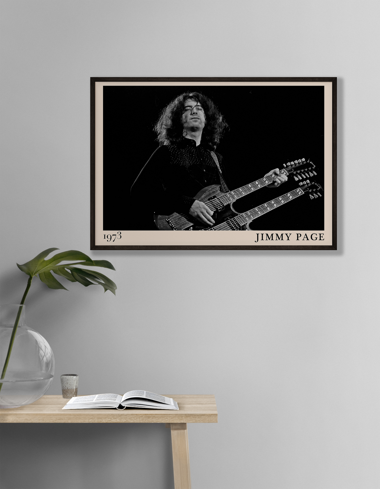 Iconic image of rock guitarist Jimmy Page performing, captured by Heinrich Klaffs and transformed into vintage-inspired wall decor hanging on a white living room wall