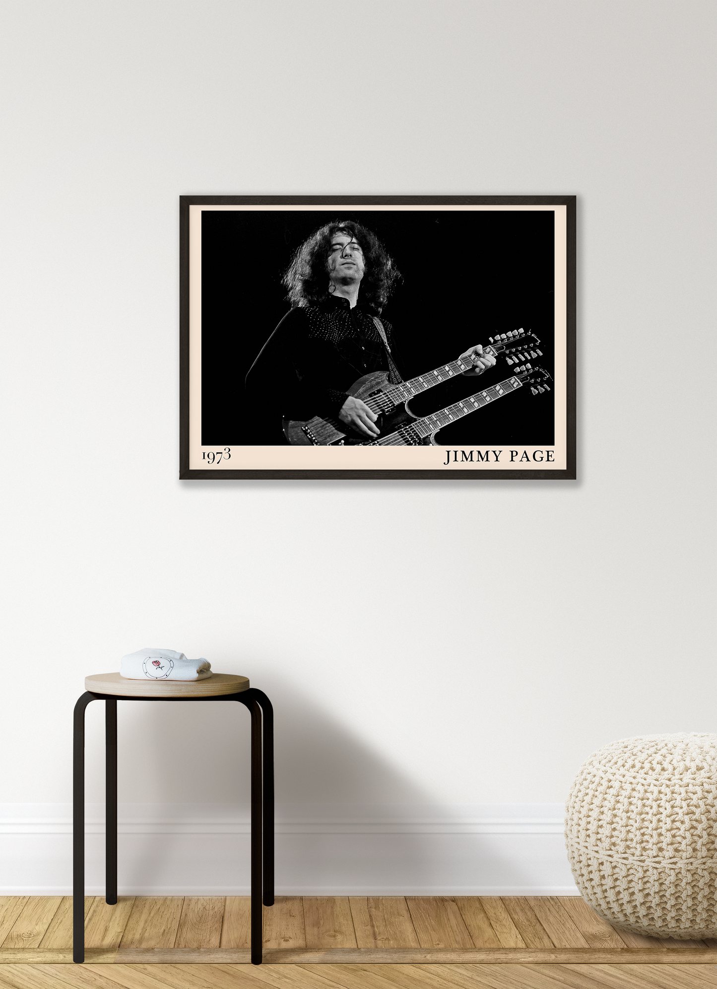 Iconic image of rock guitarist Jimmy Page performing, captured by Heinrich Klaffs and transformed into vintage-inspired wall decor hanging on a white living room wall