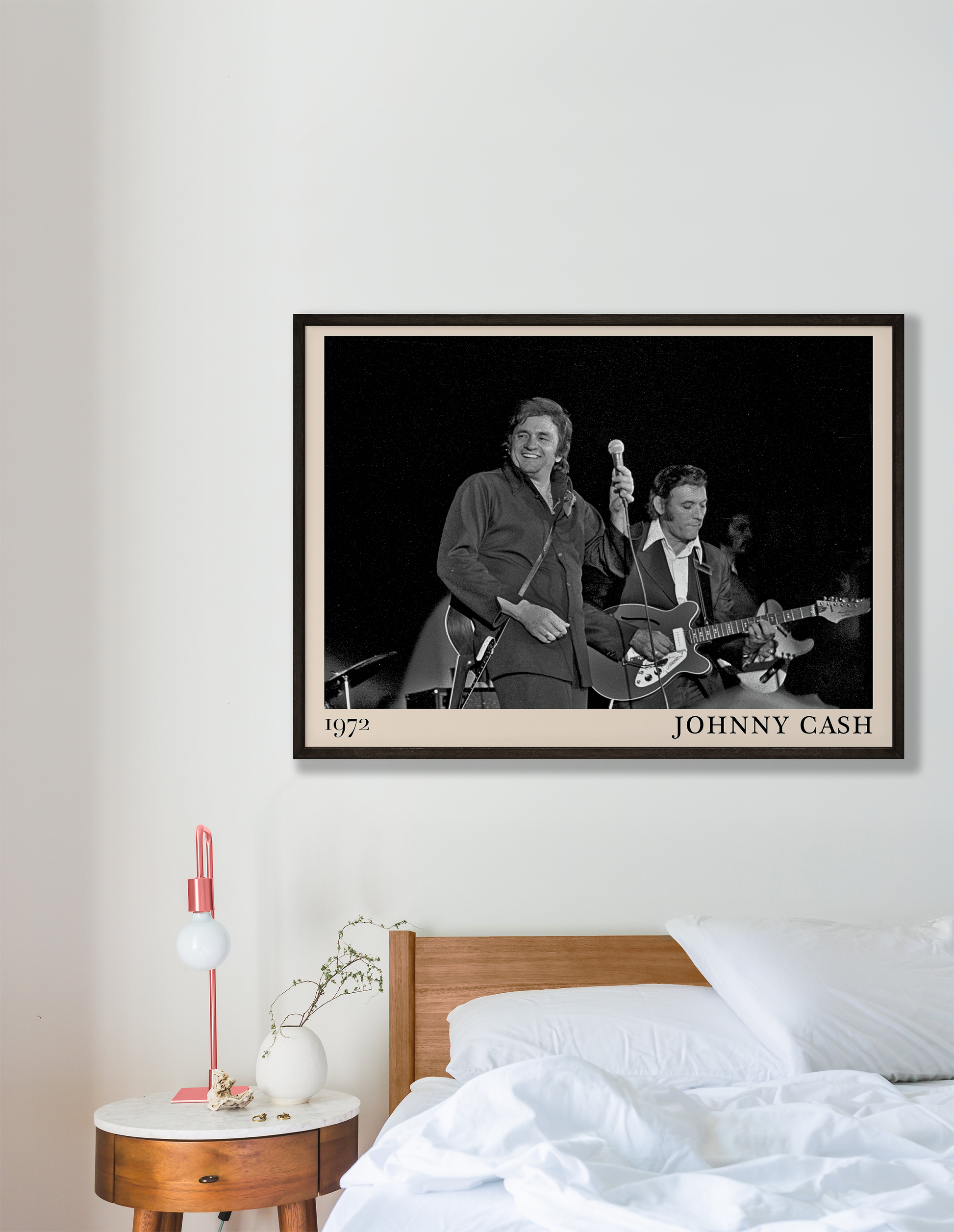 Iconic image of Jonny Cash performing, captured by Heinrich Klaffs in 1972 and transformed into vintage-inspired wall decor hanging on a white bedroom wall