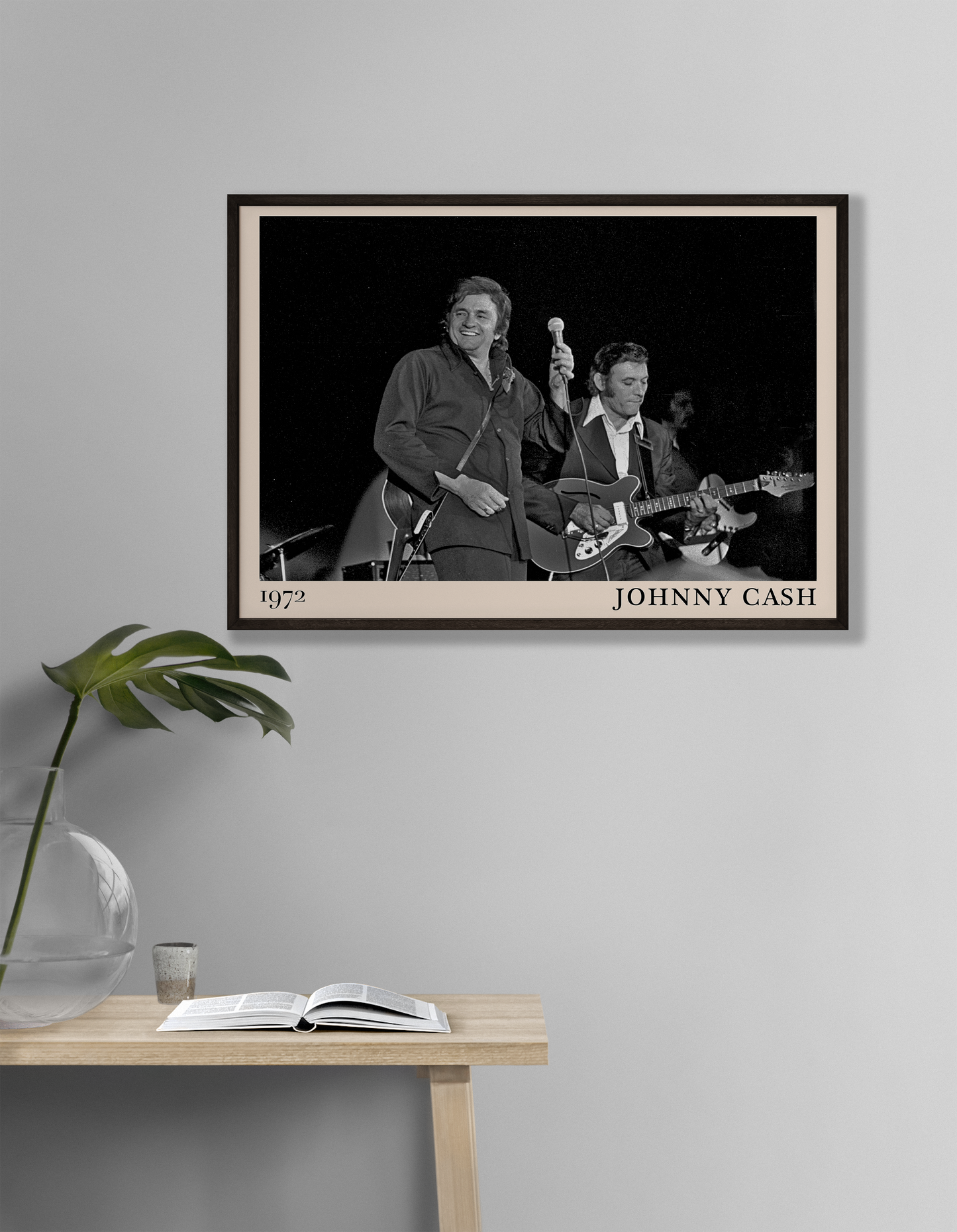 Iconic image of Jonny Cash performing, captured by Heinrich Klaffs in 1972 and transformed into vintage-inspired wall decor hanging on a white living room wall