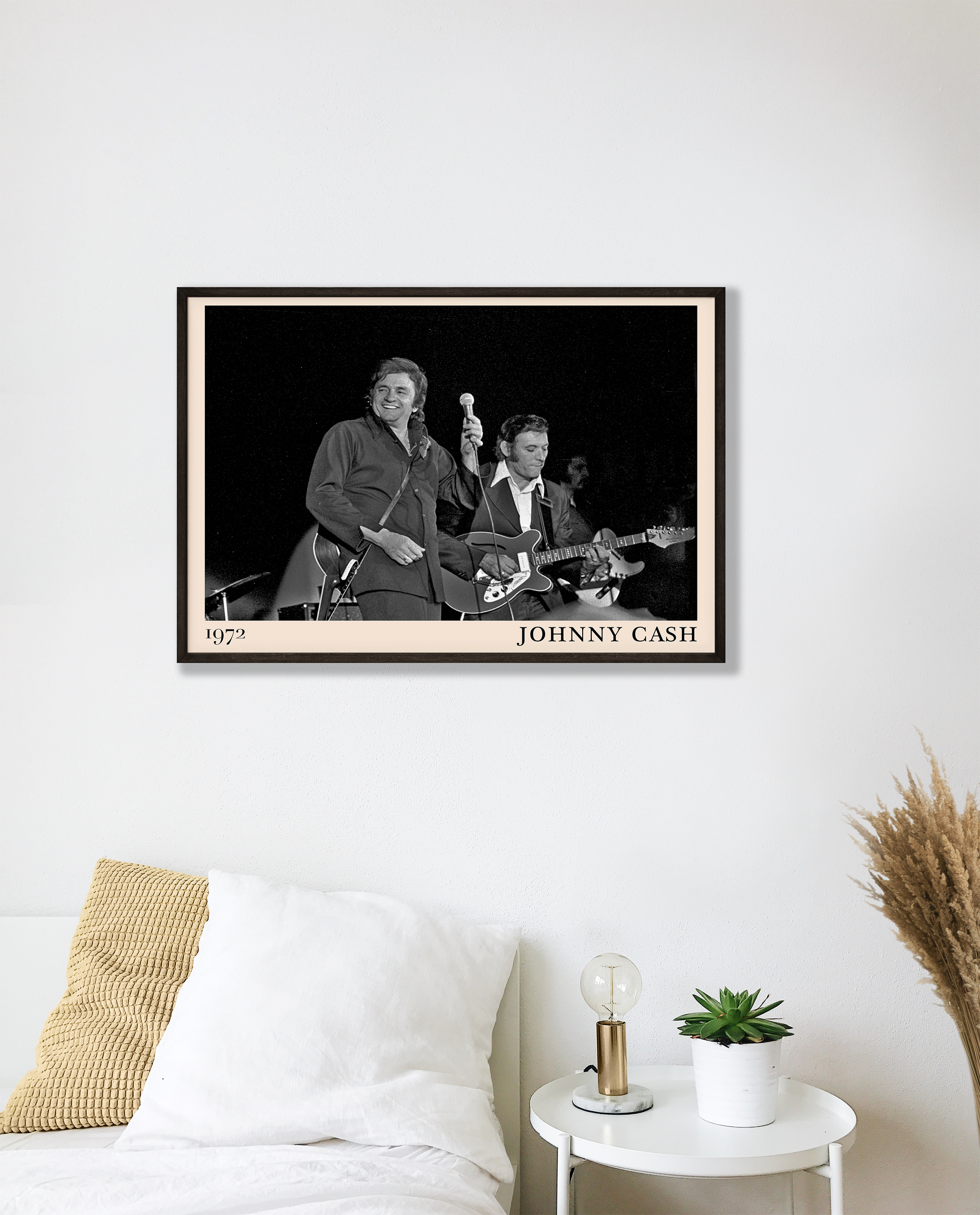 Iconic image of Jonny Cash performing, captured by Heinrich Klaffs in 1972 and transformed into vintage-inspired wall decor hanging on a white bedroom wall