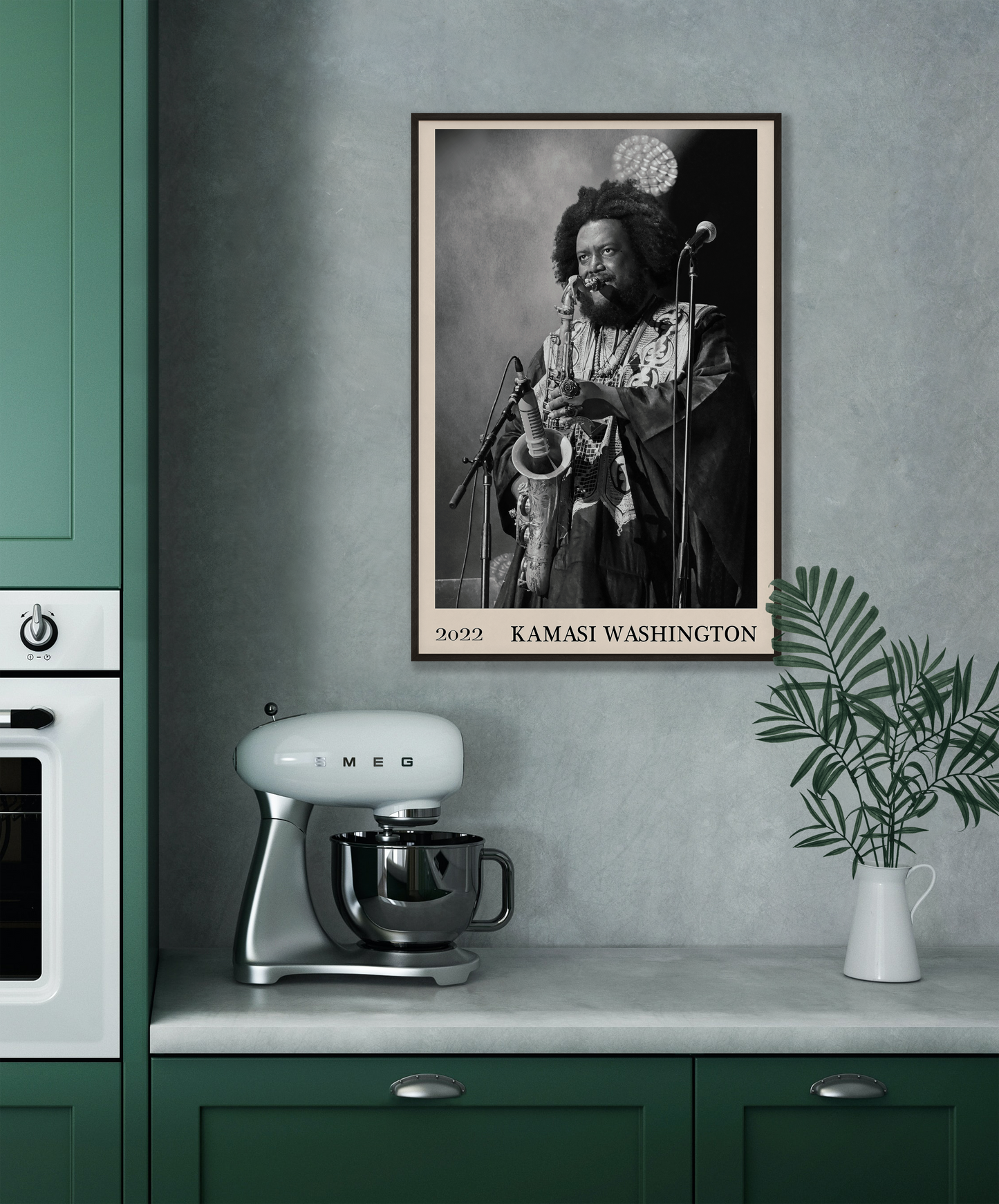 2022 photo of Kamasi Washington crafted into a black framed-poster, hanging on a grey kitchen wall