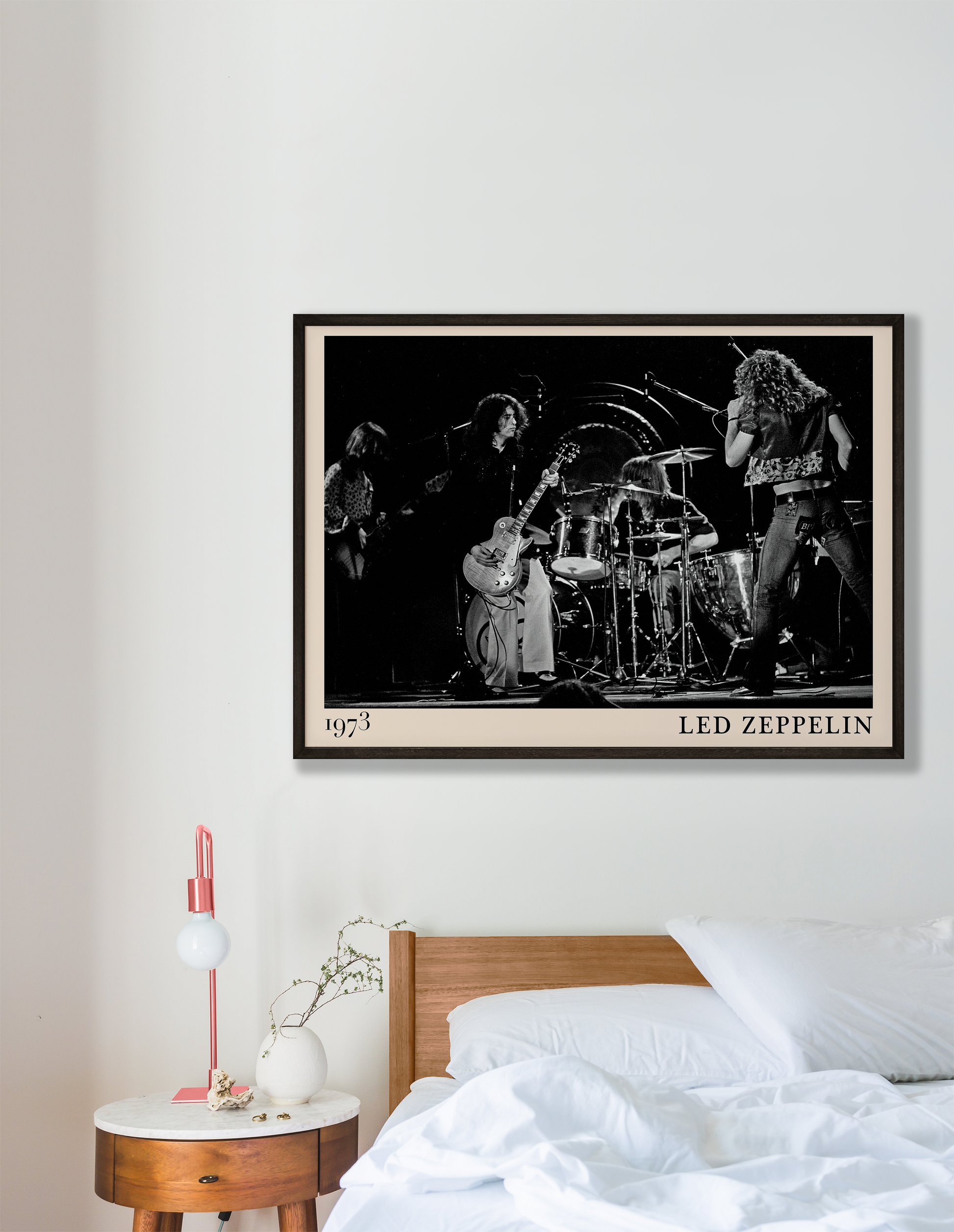 Iconic image of rock band Led Zeppelin performing, captured by Heinrich Klaffs in 1973 and transformed into vintage-inspired wall decor hanging on a white bedroom wall