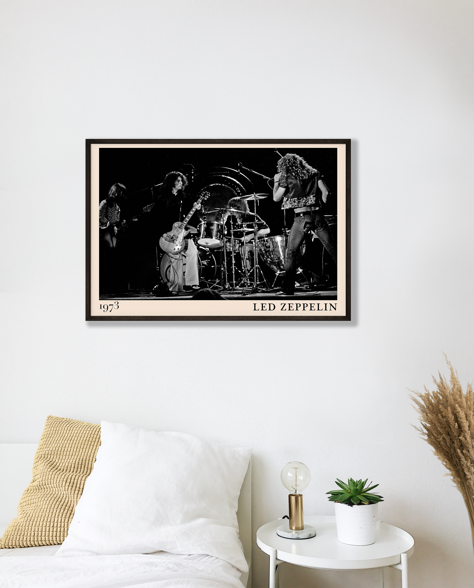 Iconic image of rock band Led Zeppelin performing, captured by Heinrich Klaffs in 1973 and transformed into vintage-inspired wall decor hanging on a white bedroom wall