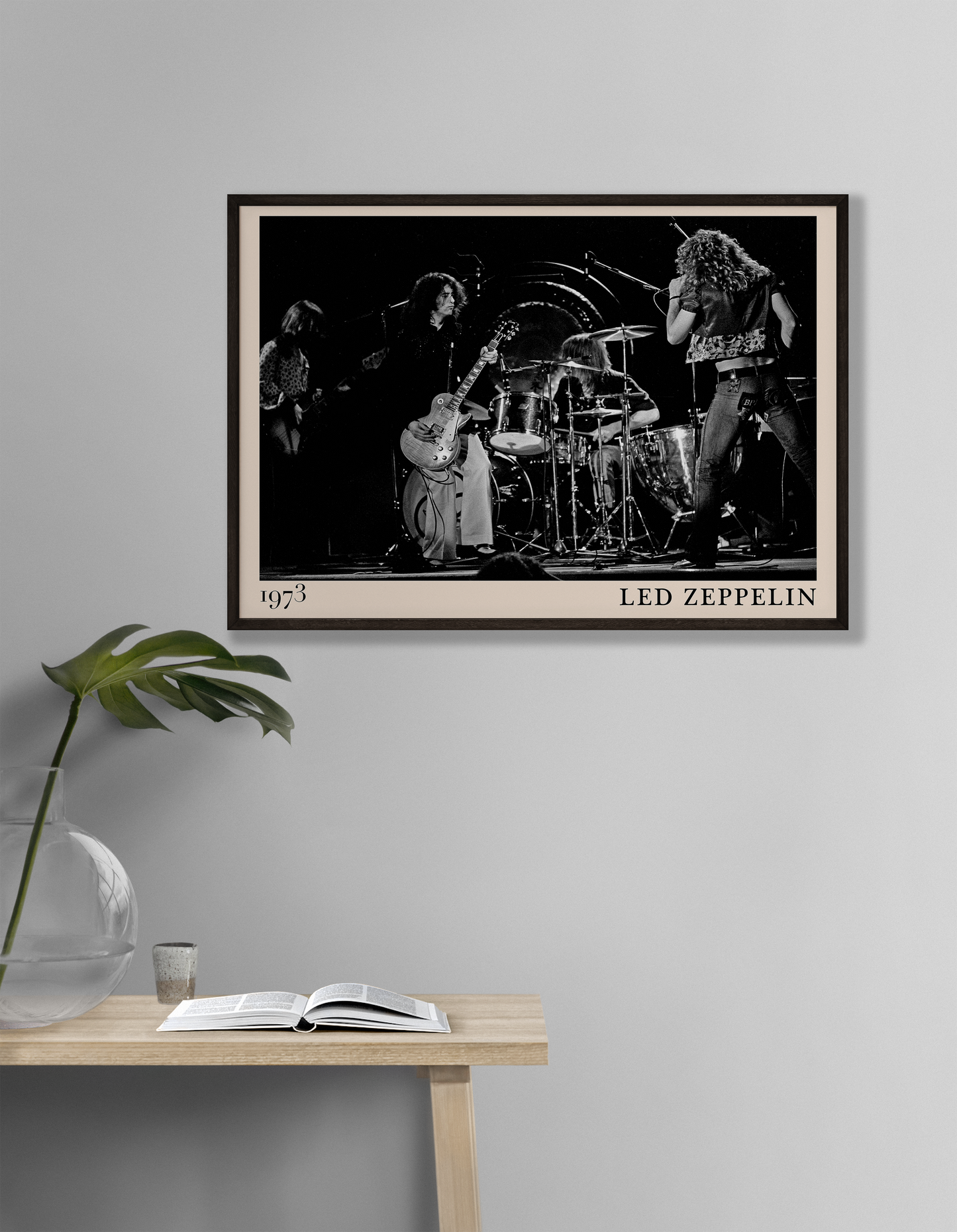 Iconic image of rock band Led Zeppelin performing, captured by Heinrich Klaffs in 19713and transformed into vintage-inspired wall decor hanging on a white living room wall