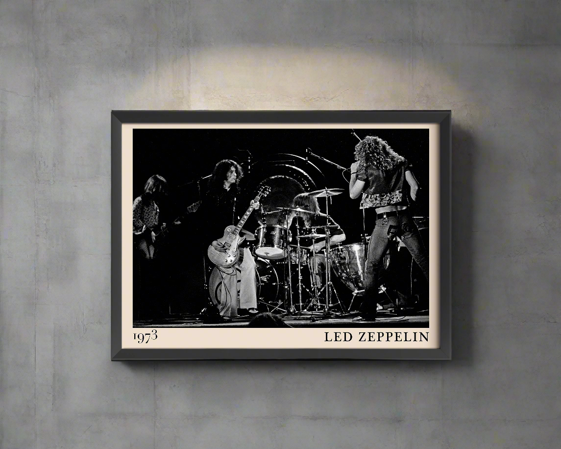 Iconic image of rock band Led Zeppelin performing, captured by Heinrich Klaffs and transformed into vintage-inspired wall decor hanging on a grey wall