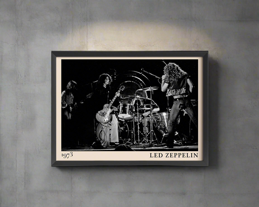 Iconic image of rock band Led Zeppelin performing, captured by Heinrich Klaffs and transformed into vintage-inspired wall decor hanging on a grey wall