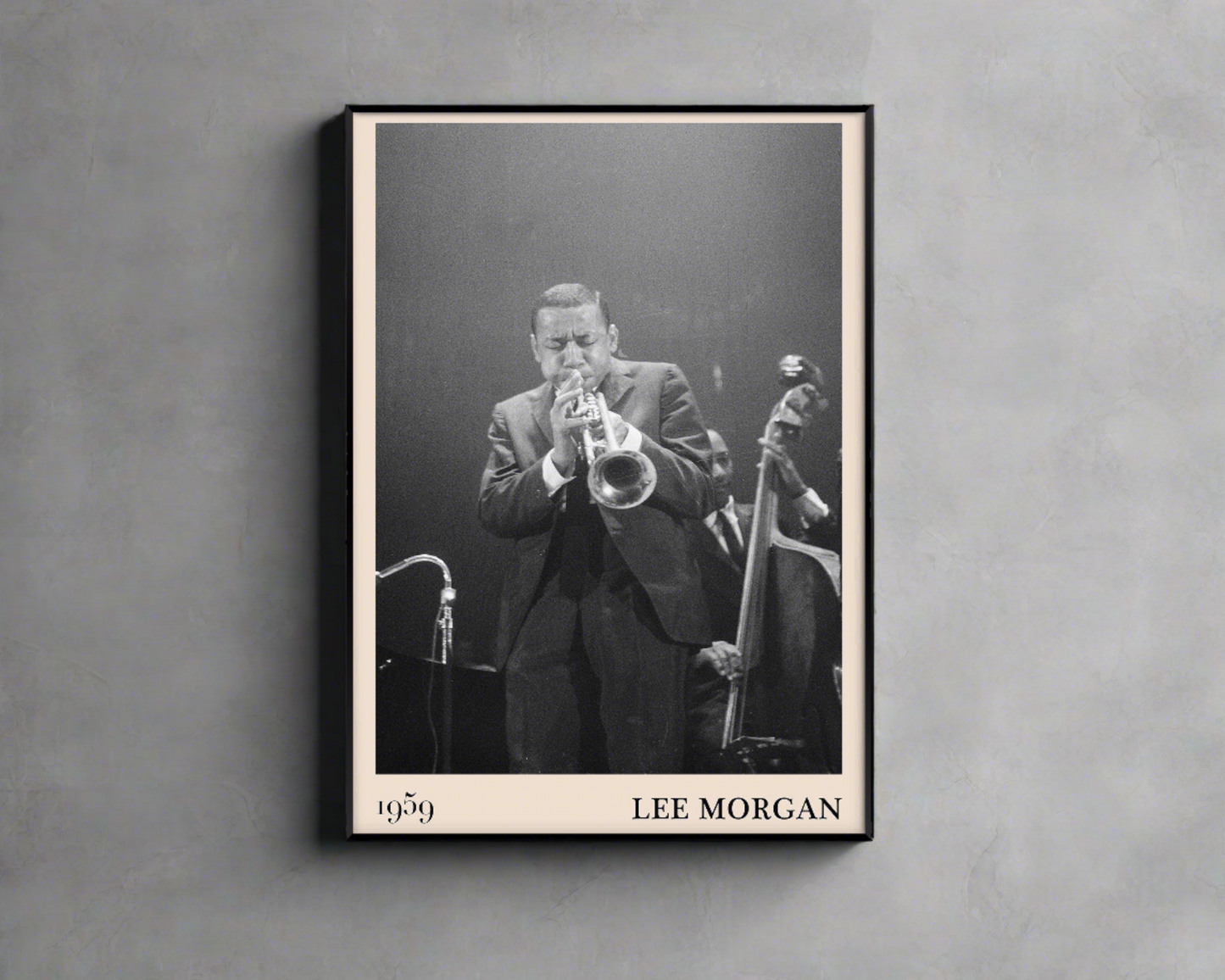 1959 photograph of Lee Morgan playing the trumpet, transformed into a stylish black-framed jazz poster hanging on a grey wall