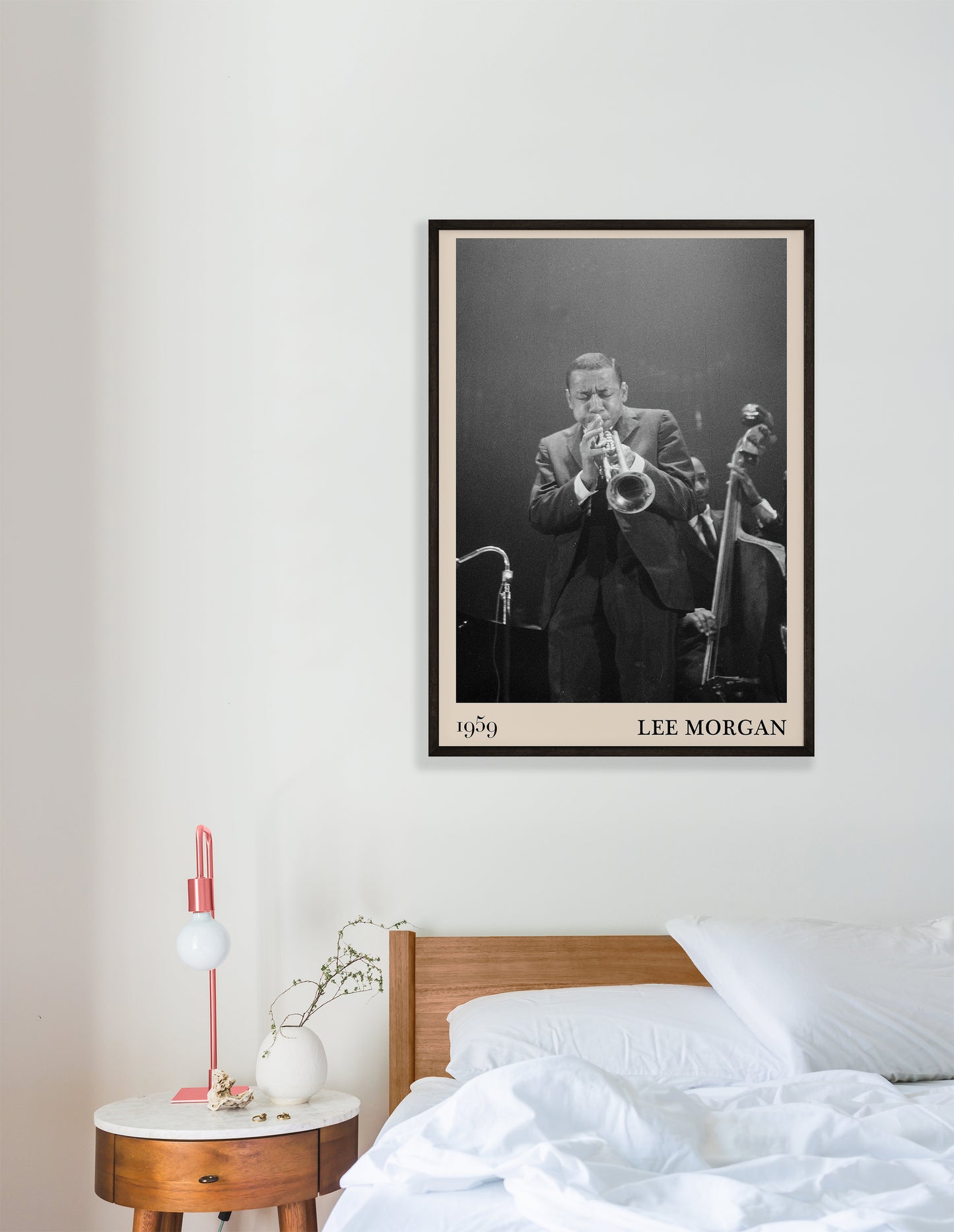1959 photograph of Lee Morgan playing the Trumpet transformed into a stylish black-framed jazz poster hanging on a white bedroom wall