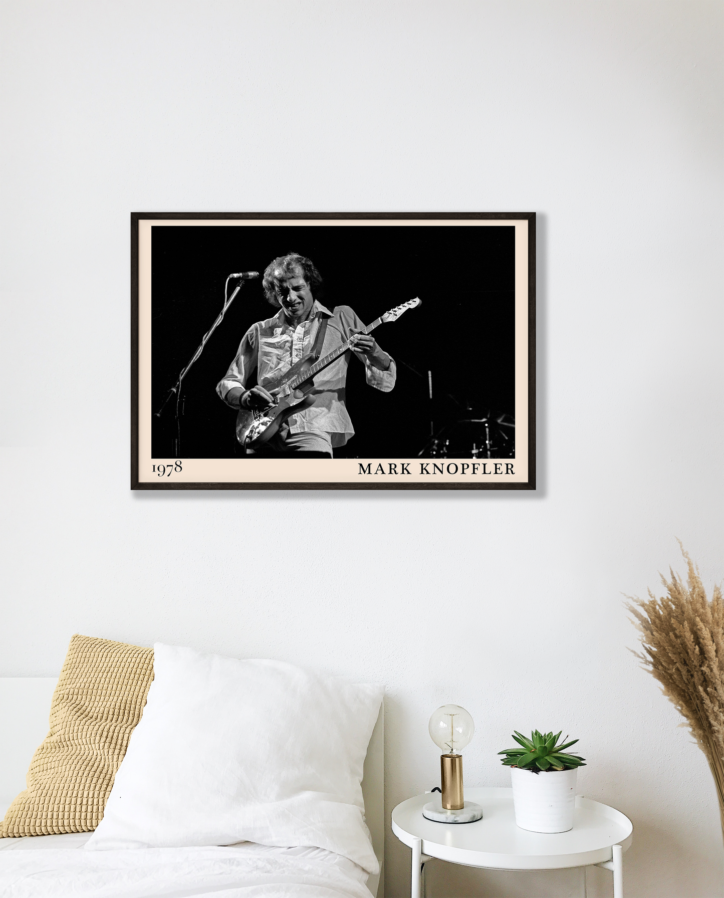 Iconic image of rock legend Mark Knopfler performing, captured by Heinrich Klaffs in 1978 and transformed into vintage-inspired wall decor hanging on a white bedroom wall