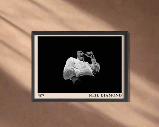 Iconic image of Neil Diamond performing, captured by Heinrich Klaffs and transformed into vintage-inspired wall decor on a peach coloured wall