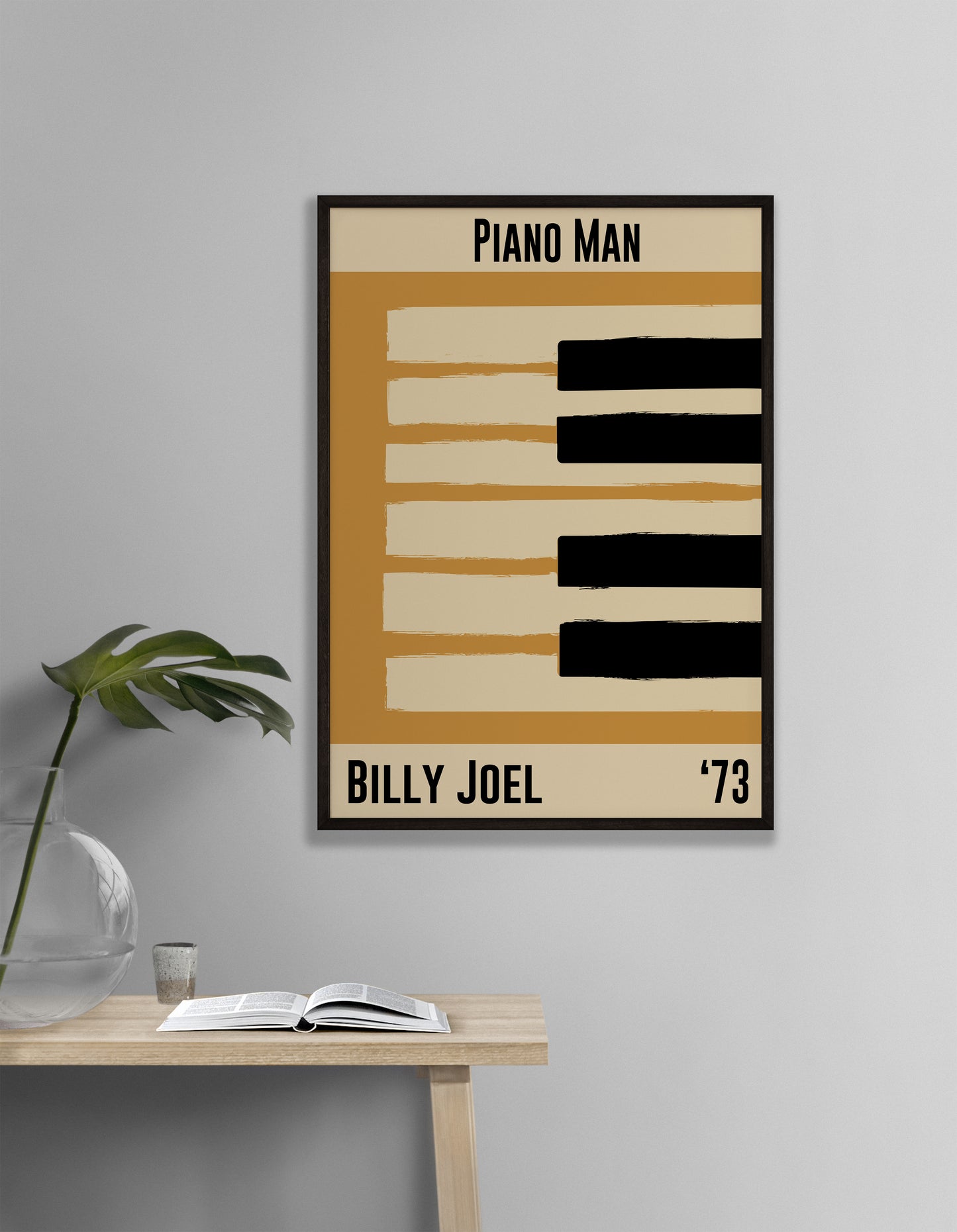 Yellow and cream piano design celebrating Billy Joel's Piano Man, released in 1973. Mocked up into black framed print hanging on white living room wall