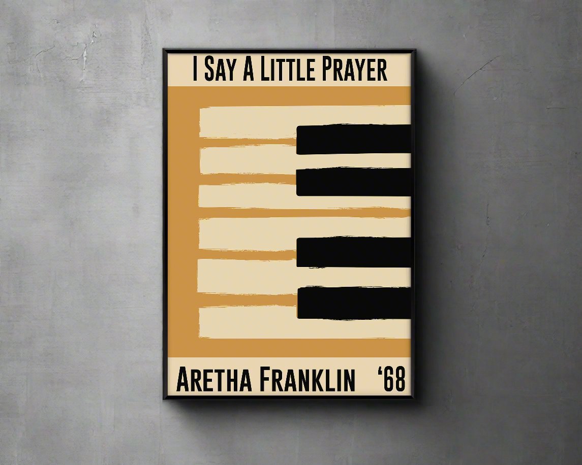 Framed  yellow jazz poster featuring a piano design and Aretha Franklin's 1968 song 'I Say a Little Prayer'. Vintage music decor, classic soul art, perfect for jazz and soul enthusiasts and Aretha Franklin fans