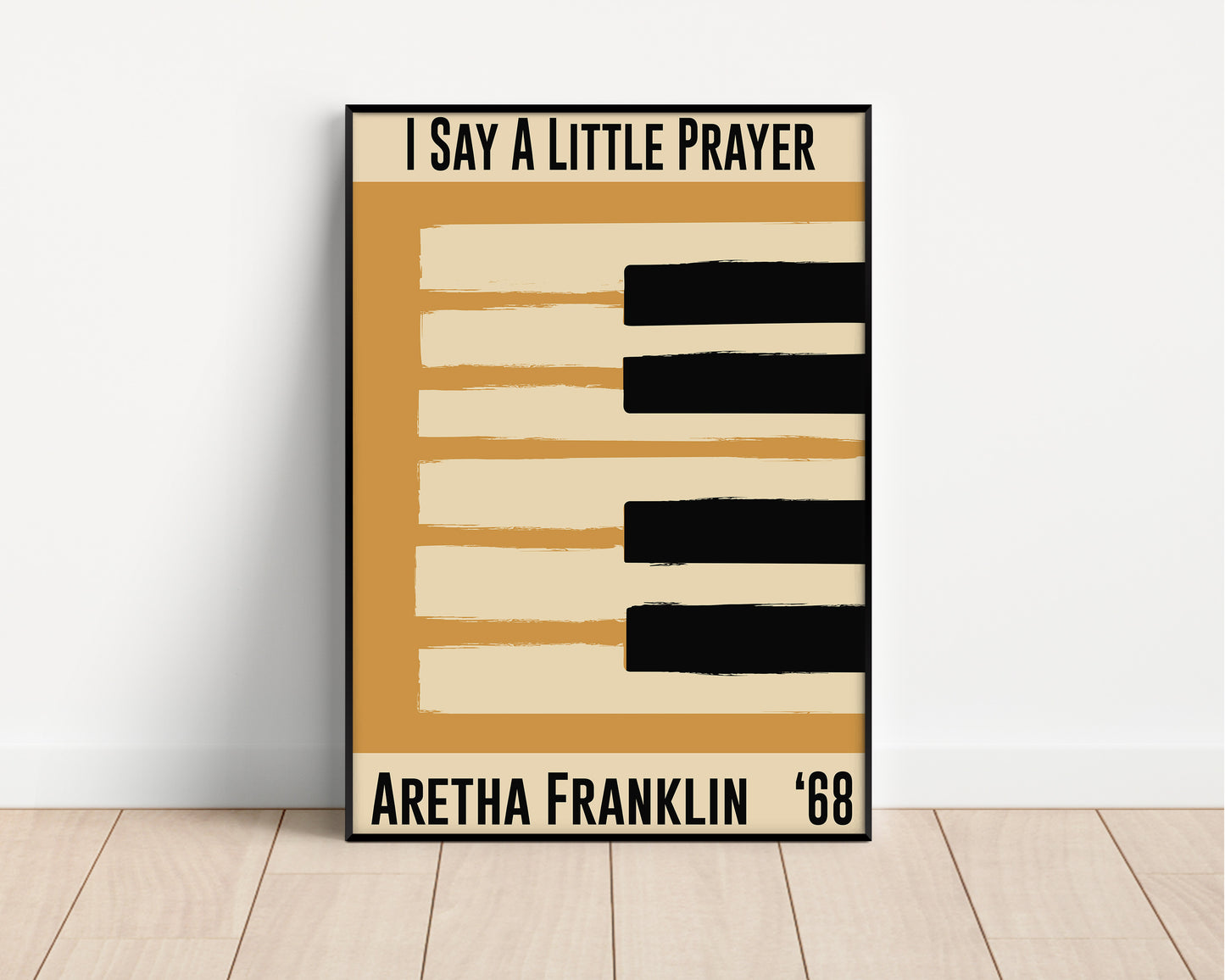 Framed yellow jazz poster featuring a piano design and Aretha Franklin's 1968 song 'I Say a Little Prayer'. Vintage music decor, classic soul art, perfect for jazz and soul enthusiasts and Aretha Franklin fans