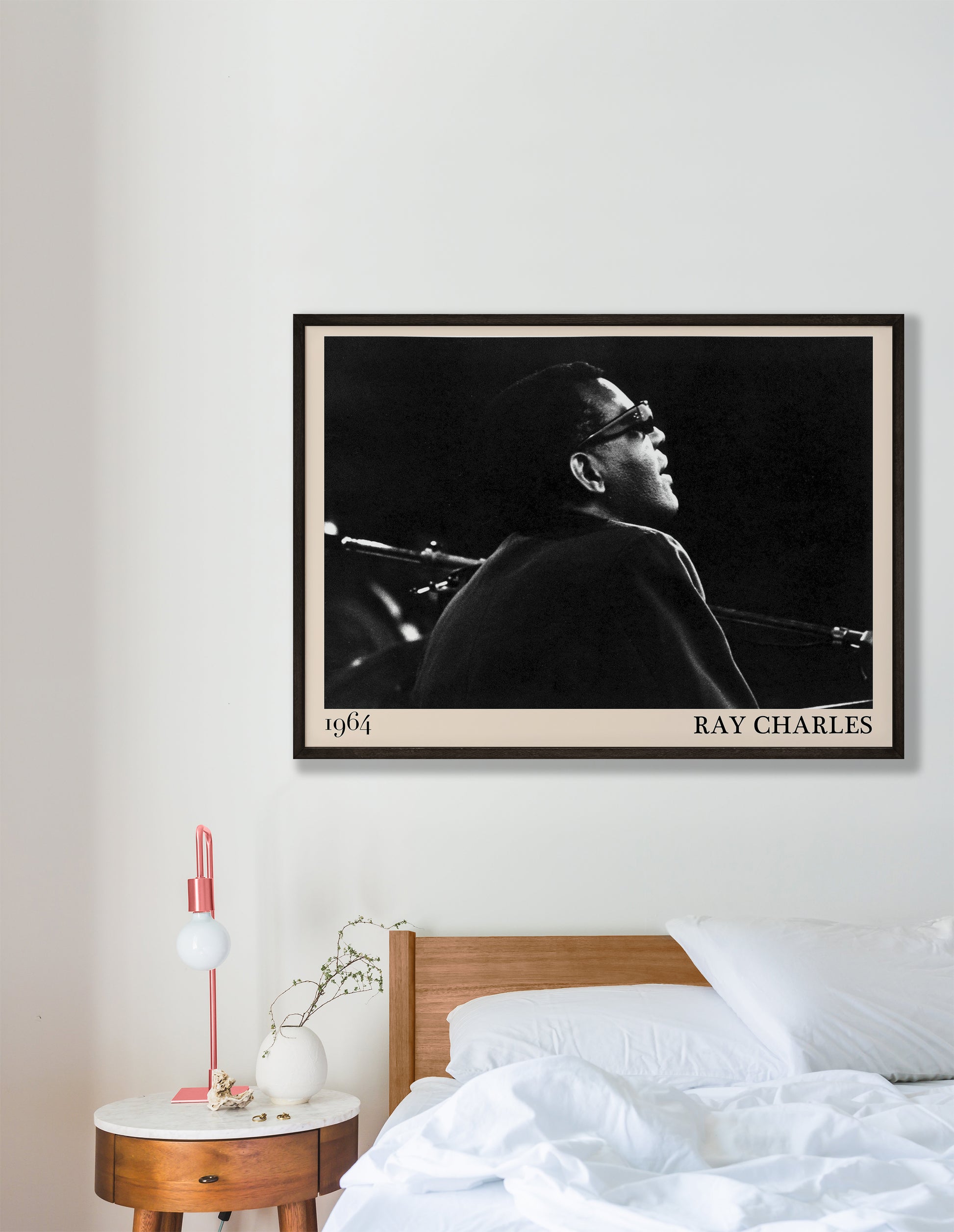 1964 photograph of blues legend Ray Charles, transformed into a retro black-framed poster hanging on a white bedroom room wall